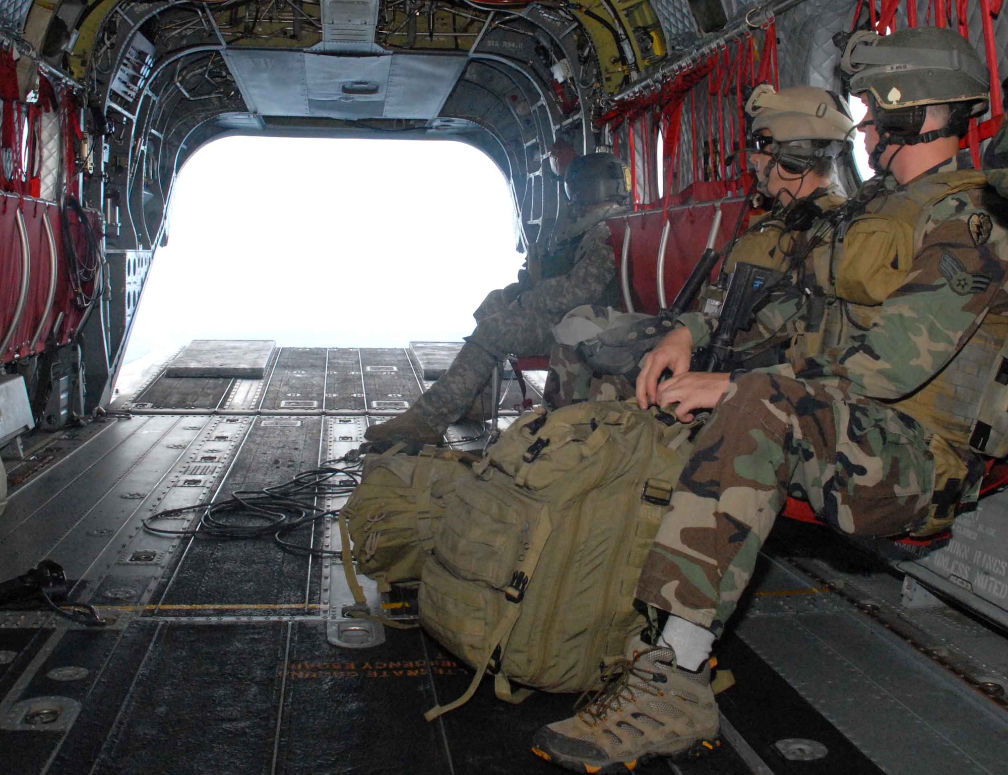 WHEELER ARMY AIR FIELD, Hawaii -- Tactical Air Control Party Airmen prepare for landing after a 30-minute ride on an Army National Guard CH-47 Chinook during training June 23-26. 25th Air Support Operations Squadron members camped at Wheeler Army Air Field's East Range near Hickam AFB to sharpen proficiencies necessary for upgrade training to become combat mission-ready Joint Terminal Attack Controllers. It’s training like this that ensures safe and reliable wartime readiness. (U.S. Air Force photo/Senior Airman Carolyn Viss)