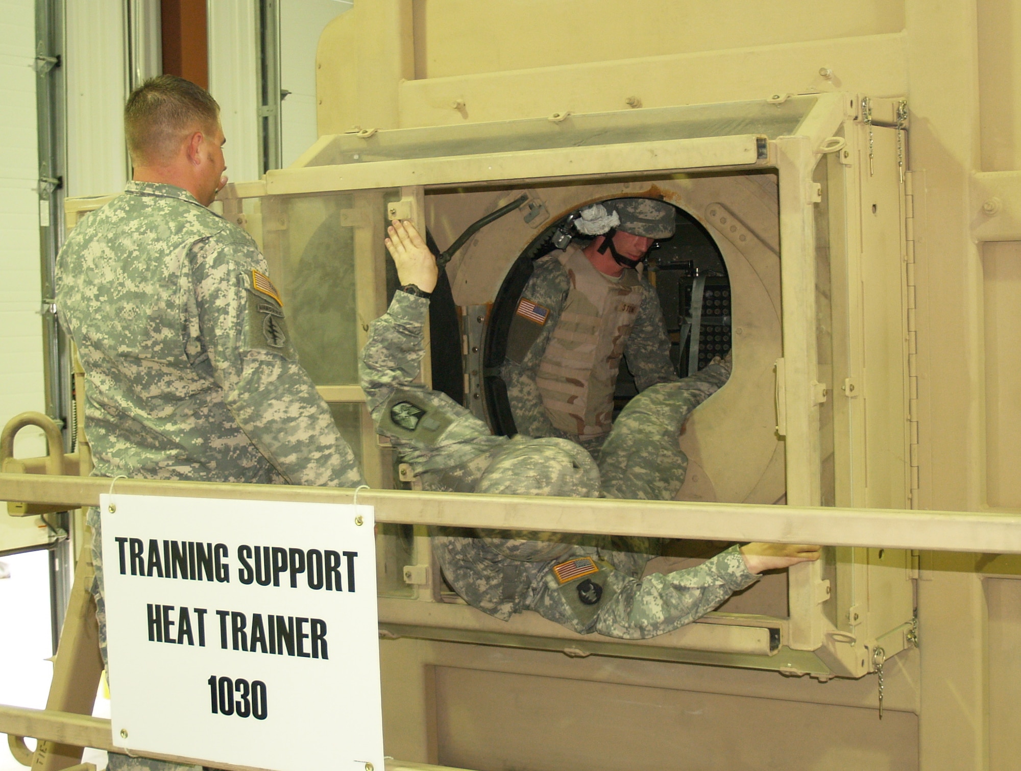 FORT MCCOY, Wis. - Army Spc. Randy Endsley, of Kansas City, Kan., and headquarters company of the 1/135th Attack Reconnaissance Battalion, helps leg-injured Army Sgt. Ryan McGuire, of Warrensburg, Mo., and 35th Combat Aviation Brigade, out of the 90-degree rolled over humvee while exercise instructor Army Sgt. Kris Smith, of Aurora and Company A of 935th Aviation Support Battalion, lends them advice on the egressing process. (Photo by Rachel Knight/Missouri National Guard)
 

