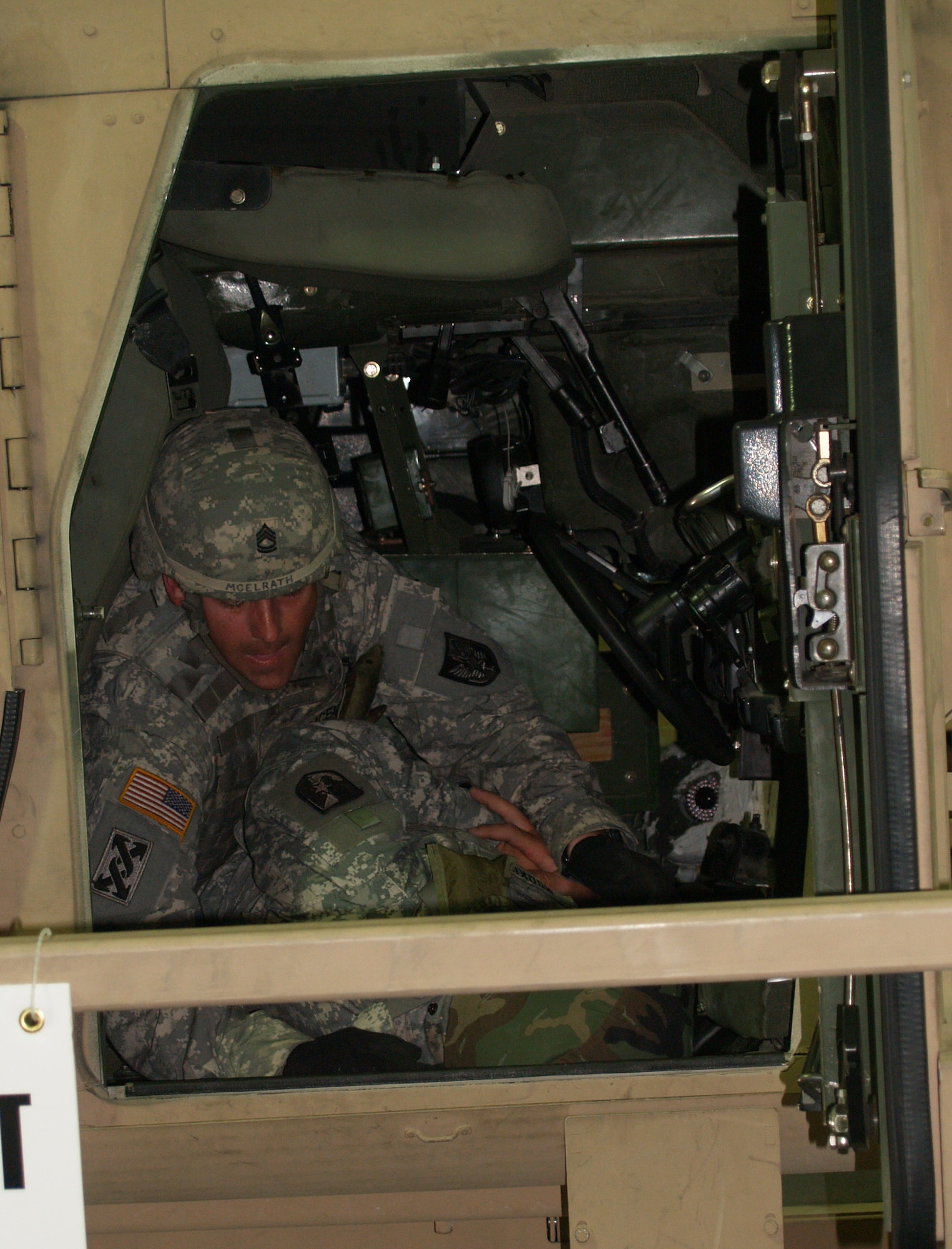 FORT MCCOY, Wis. - Army Sgt. 1st Class Leo McLerath, of Cape Girardeau, Mo., and Company A of 935th Aviation Support Battalion, found the only door to the humvee that would open after a 180-degree simulated humvee rollover. He helps the unconscious Soldier who was the driver out of the humvee. (Photo by Rachel Knight/Missouri National Guard)
 
