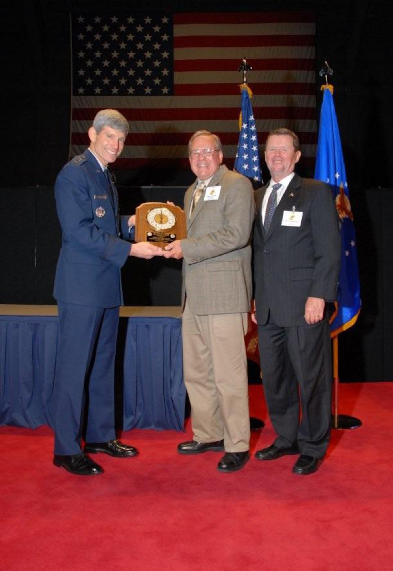 Gen. Norton A. Schwartz, Air Force Chief of Staff, presents the Air Force History and Museums Program's 2009 Albert F. Simpson Award to Mr Richard Morris, U.S. Air Force Warfare Center historian, at the Air Force History and Museum Program?s award dinner held in the Air Force Museum at Wright-Patterson AFB, Dayton, Ohio. Mr. Morris is the recipient of the award for the second time in three years. 