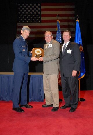 Gen. Norton A. Schwartz, Air Force Chief of Staff, presents the Air Force History and Museums Program's 2009 Albert F. Simpson Award to Mr Richard Morris, U.S. Air Force Warfare Center historian, at the Air Force History and Museum Program?s award dinner held in the Air Force Museum at Wright-Patterson AFB, Dayton, Ohio. Mr. Morris is the recipient of the award for the second time in three years. 