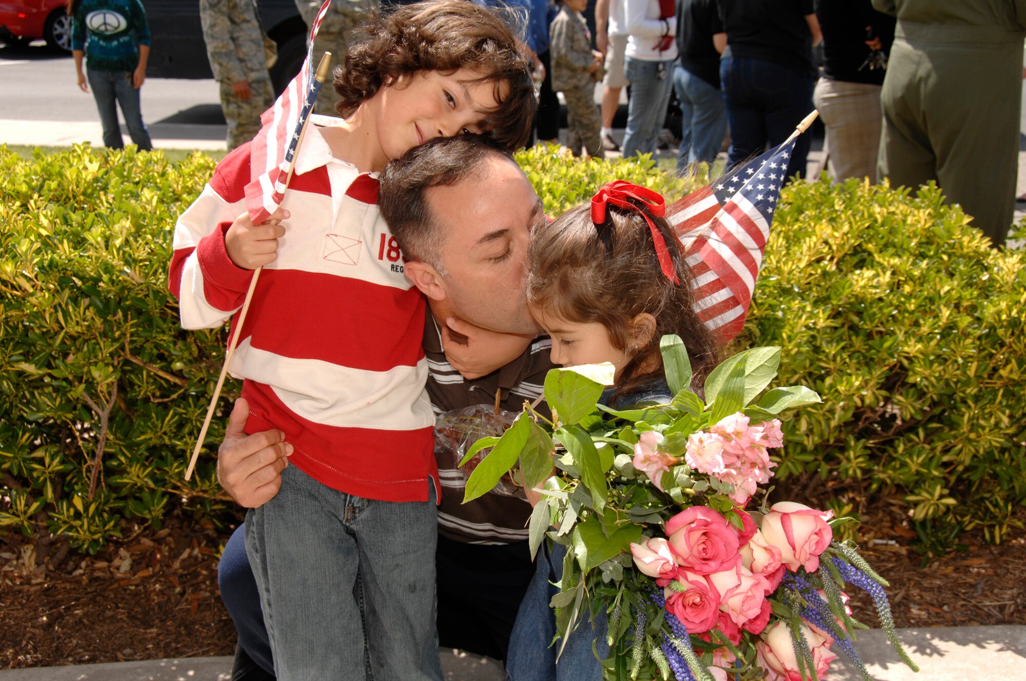 Major Jose Agredano, an MC-130P Combat Shadow pilot from the 130th Rescue Squadron, is welcomed home at Moffett Federal Airfield, Calif., by his children after a 40-day deployment to Djibouti June 13. (Air National Guard photo by Master Sgt. Dan Kacir)(RELEASED)