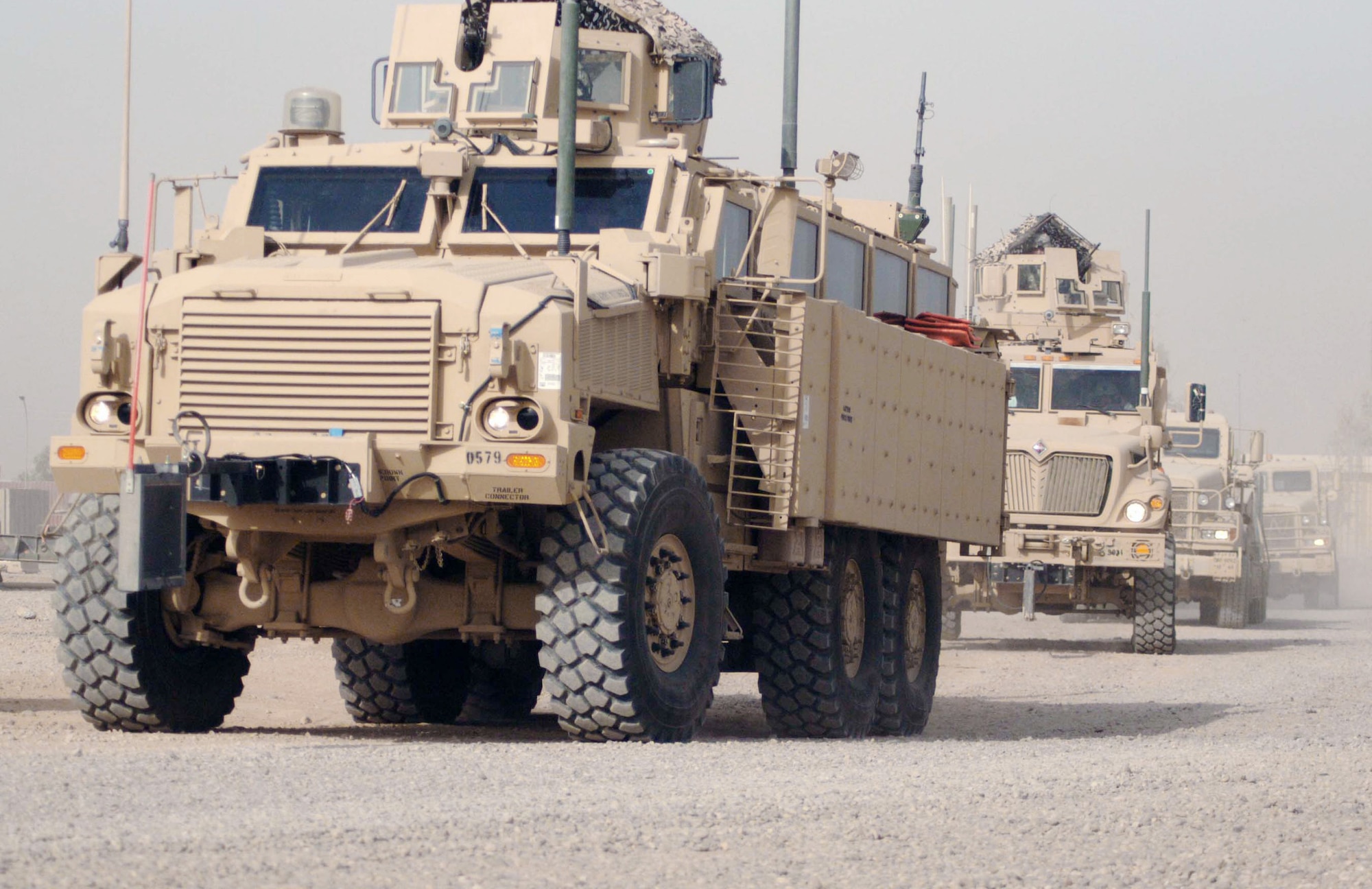 Airmen from the 732nd Expeditionary Civil Engineer Squadron Construction Team 6 head out from Joint Base Balad, Iraq, on a tactical resupply convoy to bring additional Airmen and construction materials to a construction site June 27 at Forward-Operating Base Bernstein, Iraq. The team is constructing five Southwest Asia huts there to support the beddown of Soldiers who are withdrawing from the inner cities of Iraq in accordance with the U.S.-Iraqi Security Agreement signed in November 2008, which states servicemembers are to withdraw from Iraqi cities by June 30. Additionally, the 732nd ECES CT 6 Airmen will correct electrical and plumbing safety issues. (U.S. Air Force photo/Staff Sgt. John Gordinier)