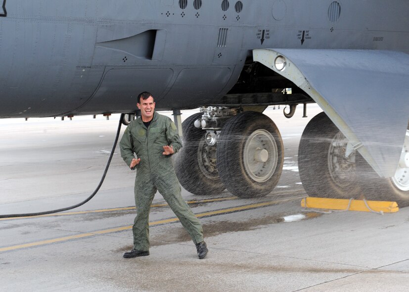 MINOT AIR FORCE BASE, ND -- Col. Parker Northrup III, 5th Operations Group commander, is sprayed down after his final B-52H Stratofortress flight here Jun 29. Colonel Northrup is leaving Minot for a new assignment at the Defense Threat Reduction Agency in Ft. Belvoir, Va. (U.S. Air Force photo by Staff Sgt. Keith Ballard) 