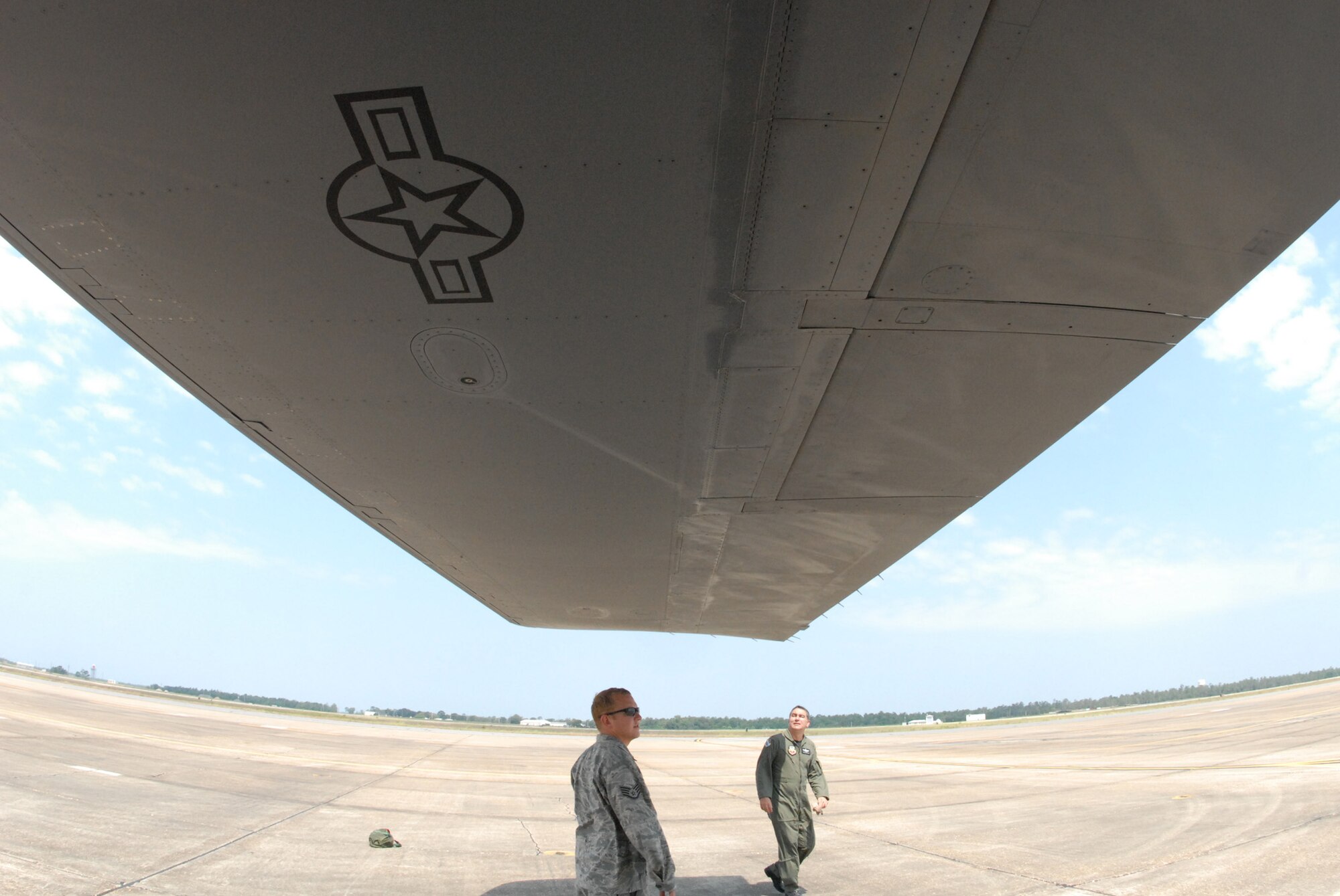EGLIN AIR FORCE BASE, Fla. - Staff Sgt. Matthew Penrod, 337th Test and Evaluation Squadron, and Col. Mick Guthals complete an inspection of the B-1 Lancer before takeoff on its flight back home to Dyess, AFB. The B-1 was here representing the 337th TES for the assumption-of-command ceremony for the 53rd Wing.  It is a long-range, multi-role, heavy bomber capable of speeds of 900-plus miles per hour. Its wingspan fully extended is 137 feet and can fly intercontinental unrefueled. (U.S. Air Force photo/ Samuel King Jr.)