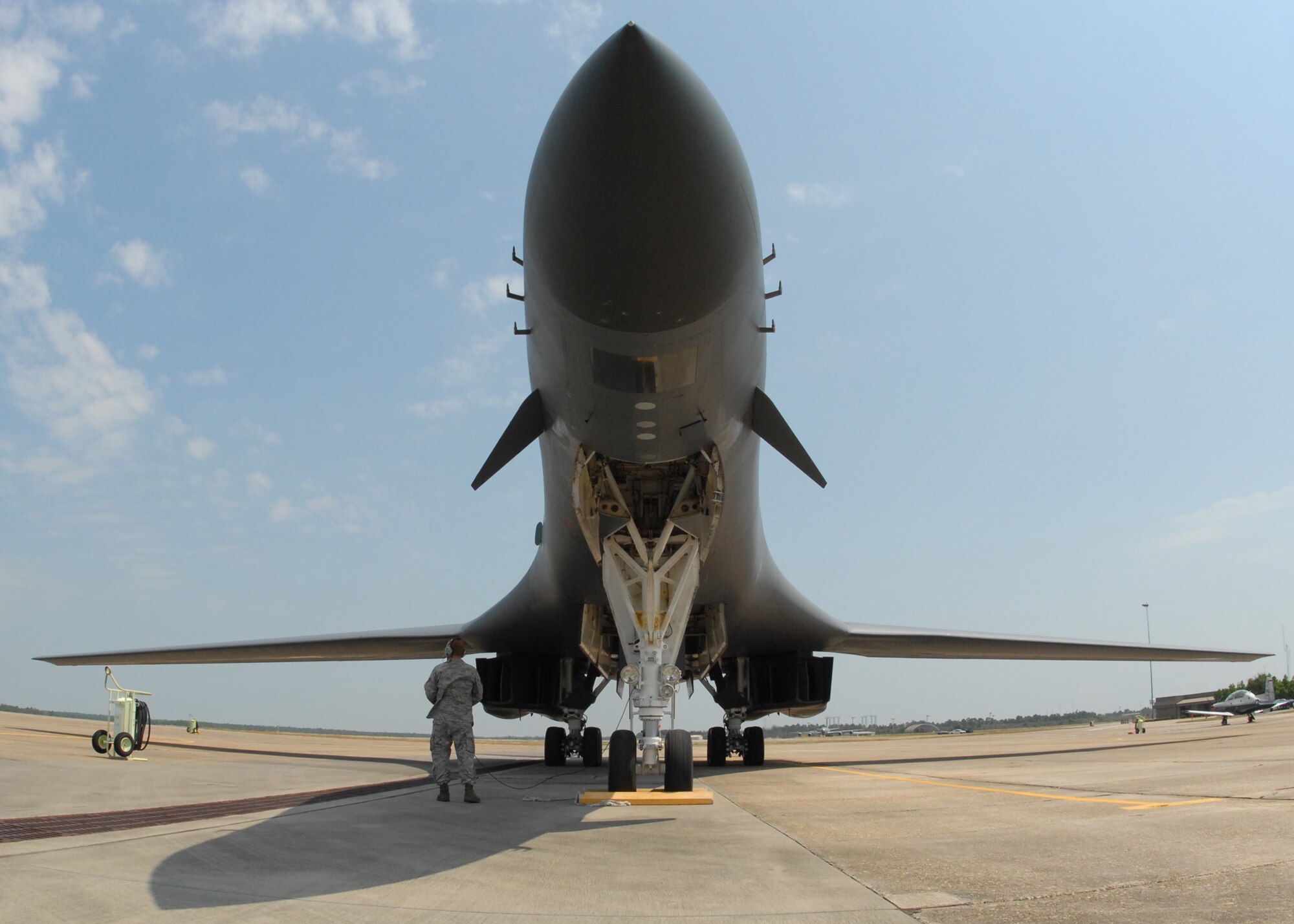EGLIN AIR FORCE BASE, Fla. - Staff Sgt. Matthew Penrod, 337th Test and Evaluation Squadron, waits for the green light for the B-1B Lancer to takeoff on its flight back home to Dyess, AFB. The B-1 was piloted by a crew of four, including Col. Mick Guthals, 53rd Wing vice commander. The B-1 was here representing the 337th TES for the assumption-of-command ceremony for the 53rd Wing.  It is a long-range, multi-role, heavy bomber capable of speeds of 900-plus miles per hour. Its wingspan fully extended is 137 feet and can fly intercontinental unrefueled. (U.S. Air Force photo/ Samuel King Jr.)