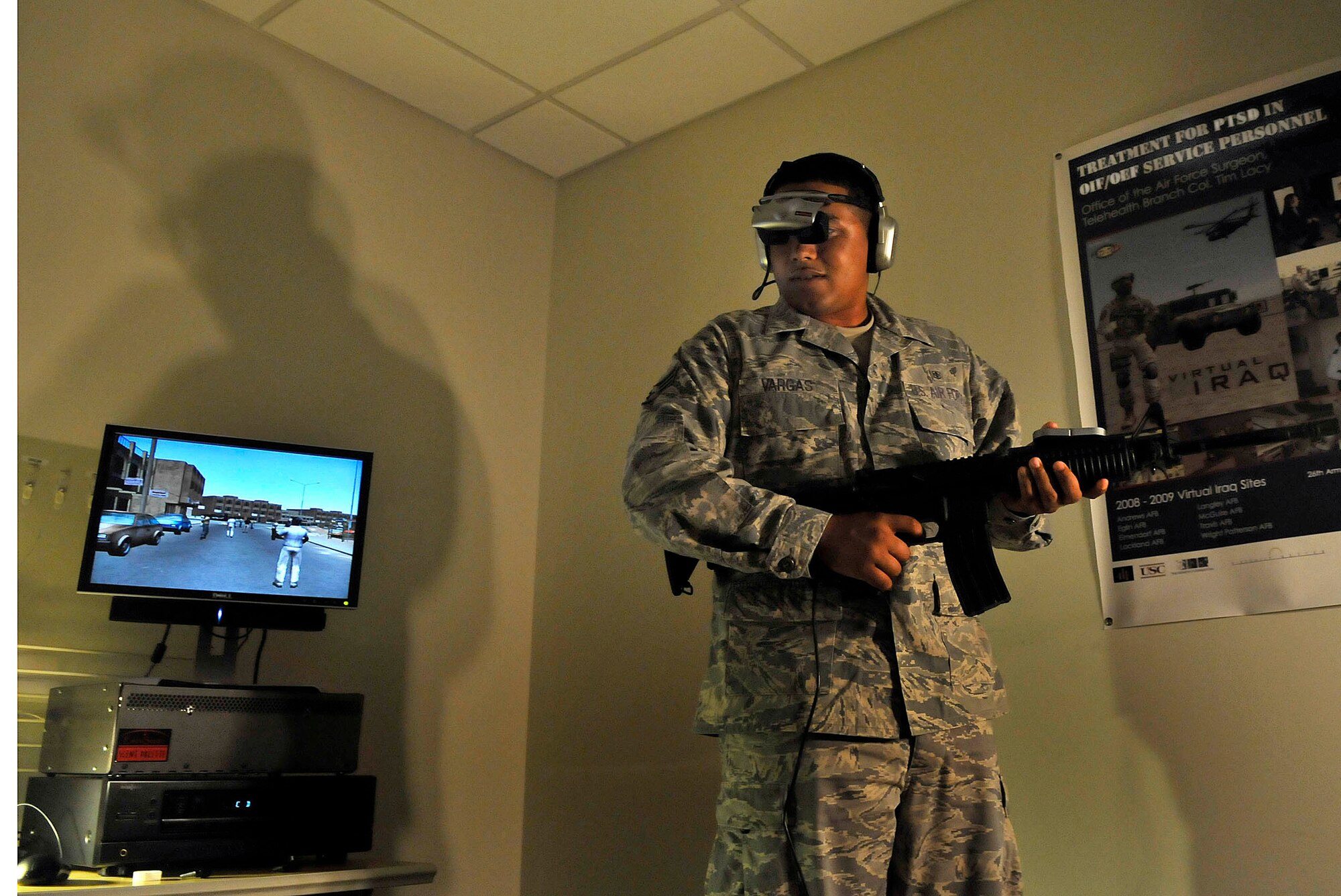 Senior Airman Joseph Vargas, a pharmacy technician with the 779th Medical Support Squadron, uses the Virtual Iraq program at Malcolm Grow Medical Center's Virtually Better training site on Andrews Air Force Base, Md. on June 25, 2009. The 79th Medical Wing is one of eight wings to use this new technology to treat patients suffering from post traumatic stress disorder. (U.S. Air Force photo by Senior Airman Renae Kleckner)(released)