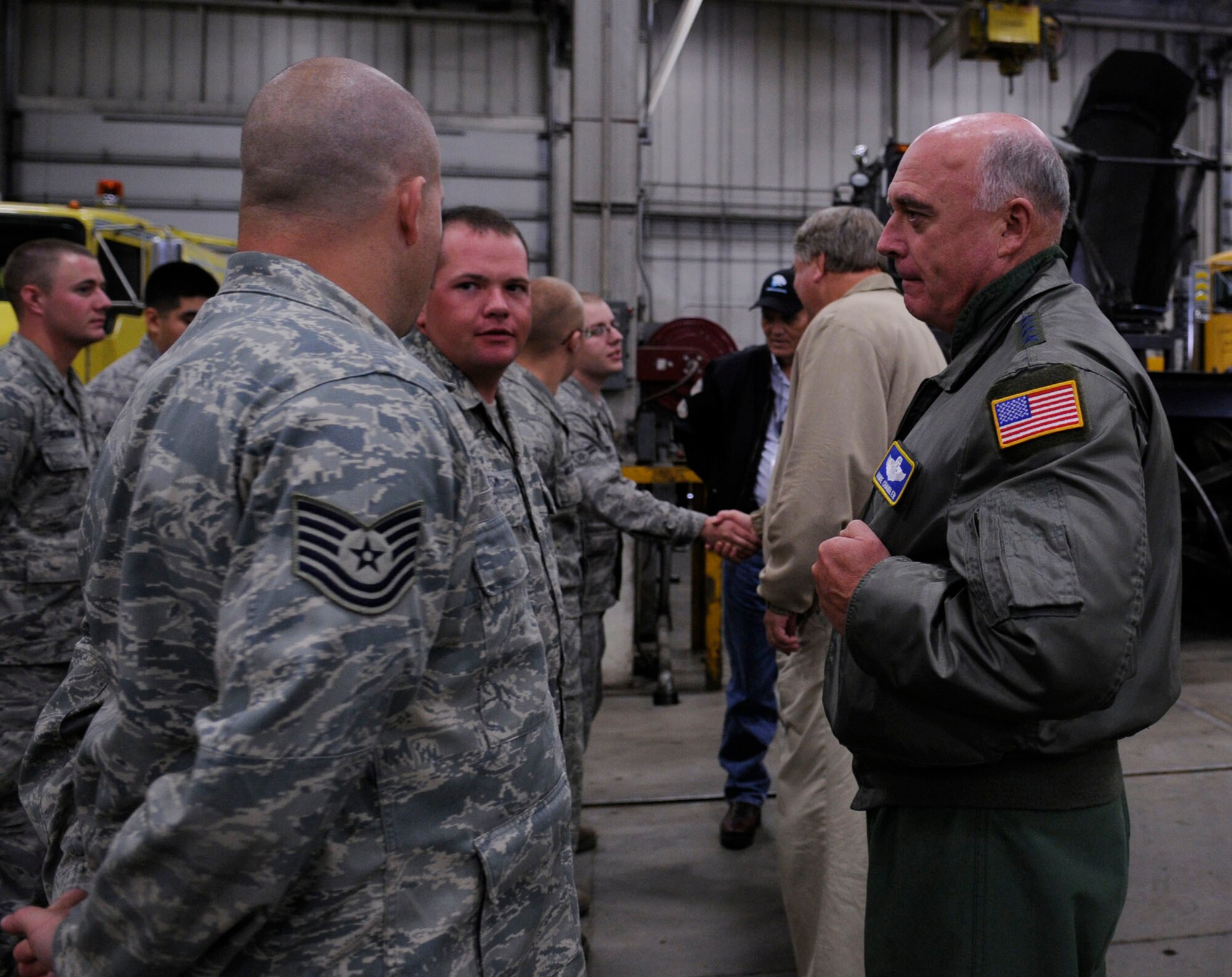 Gen. Howie Chandler visits with Airmen June 24, 2009, Eieson Air Force Base, Alaska. General Chandler participated in the Strategic Triangle Civic Leadership Tour which provided mission oriented, hands-on experience for civic leaders throughout the Pacific Air Force region. General Chandler is the commander of the Pacific Air Forces based out of Hawaii, the Airmen are with the 354th Civil Engeneering Squadron. (U.S. Air Force photo/Airman 1st Class Laura Max)