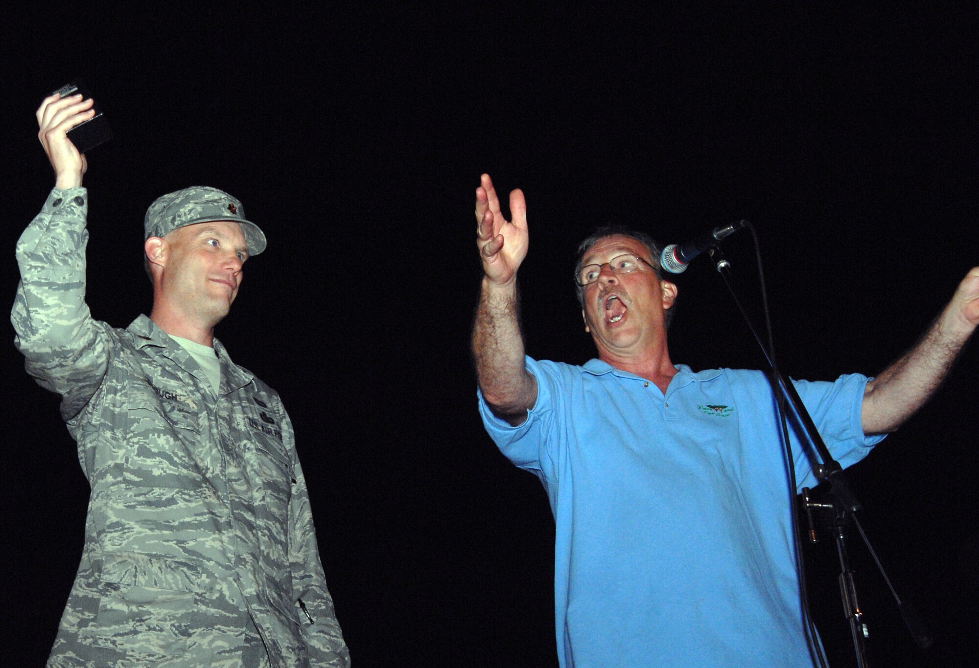 GREENWOOD, Mo. - Maj. Brian Clough, 509th Maintenance Operations Squadron research engineering flight commander, kicks off the fireworks display at the Greenwood, Mo. 19th Annual Independence Day Celebration June 27 with Mr.  Dan Van Sickle, president of the city of Greenwood’s park board.  Major Clough was selected to initiate the fireworks in honor of deployed and local military members who serve are currently serving and are veterans.

“We wanted to make sure that this event reflected the spirit of patriotism,” said Mr. Van Sickle.

Other military members who were honored are Chief Warrant Officer 3 John Terry, 1st Infantry Division field artillery officer  due to deploy for a third time to Southwest Asia  and the Vietnam Veterans Association’s  Chapter 243 who also featured a static display of a “Huey” UH-1H helicopter.
