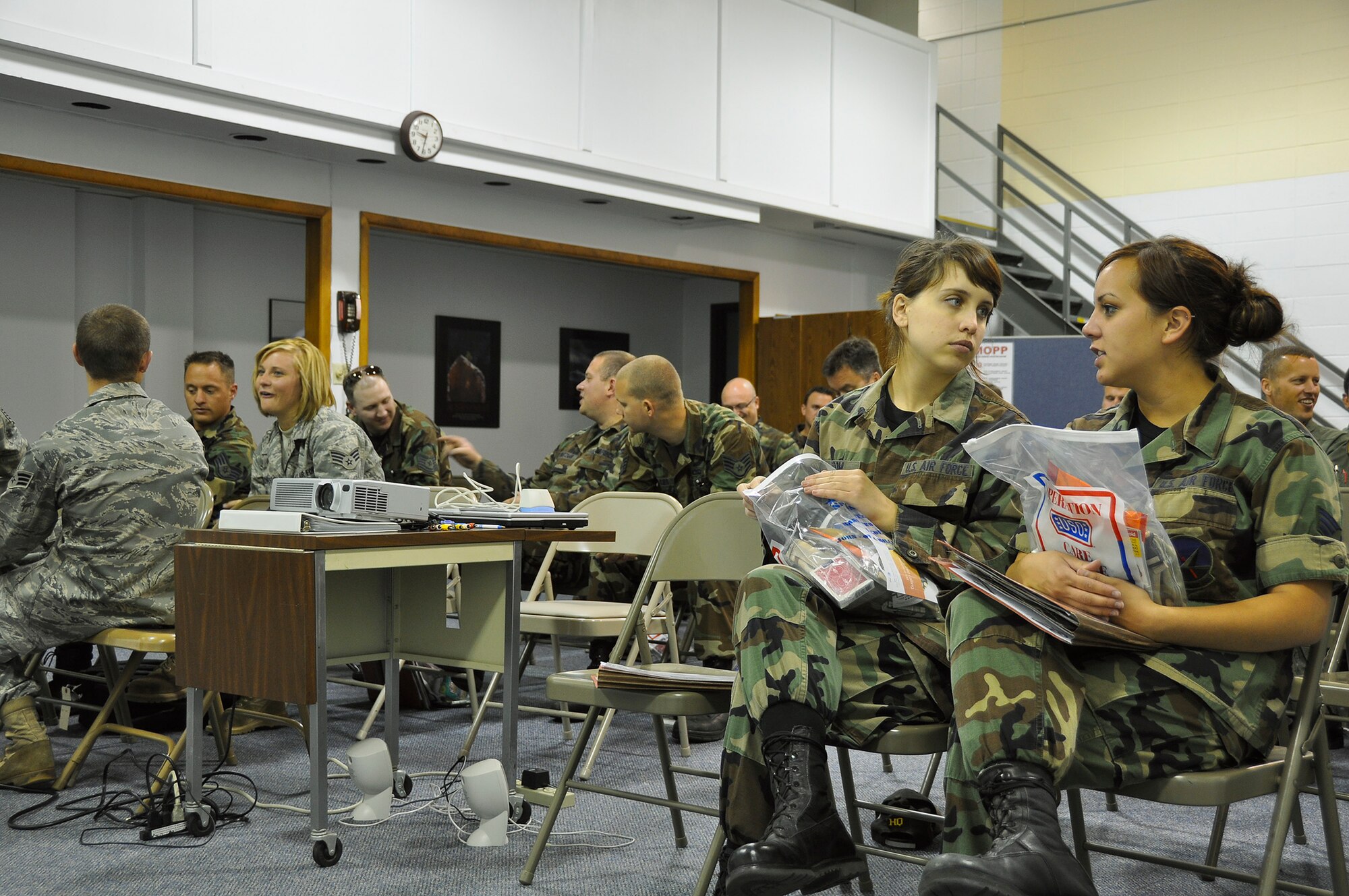 Airmen from the 128th Air Refueling Wing wait to receive briefings as part of the wing's pre-deployment process on Tuesday, June 30, 2009.  The briefings were given by medical readiness personnel, family support staff, personnel specialists, intel officers, and the civil engineering squadron’s threat readiness specialists.  (U.S. Air Force photo by Senior Airman Ryan Kuntze)