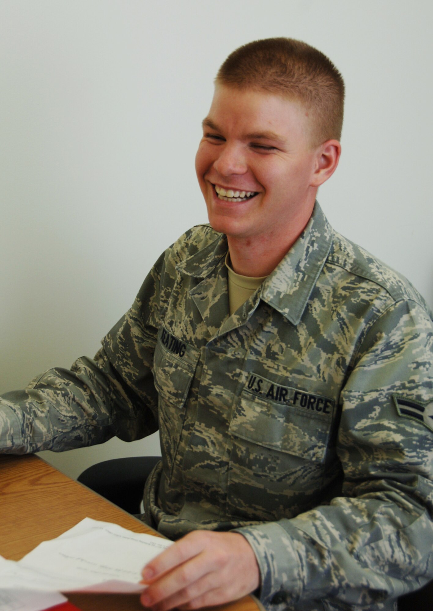 Airman 1st Class Cameron Keating enjoys a lighter moment while training inside the headquarters building of the 931st Civil Engineer Squadron at McConnell Air Force Base, Kan. Airman Keating is assigned to the squadron's structures/carpentry section. His squadron is part of the 931st Air Refueling Group, an Air Force Reserve unit at McConnell. (U.S. Air Force photo/Senior Airman Connor Burkhard)