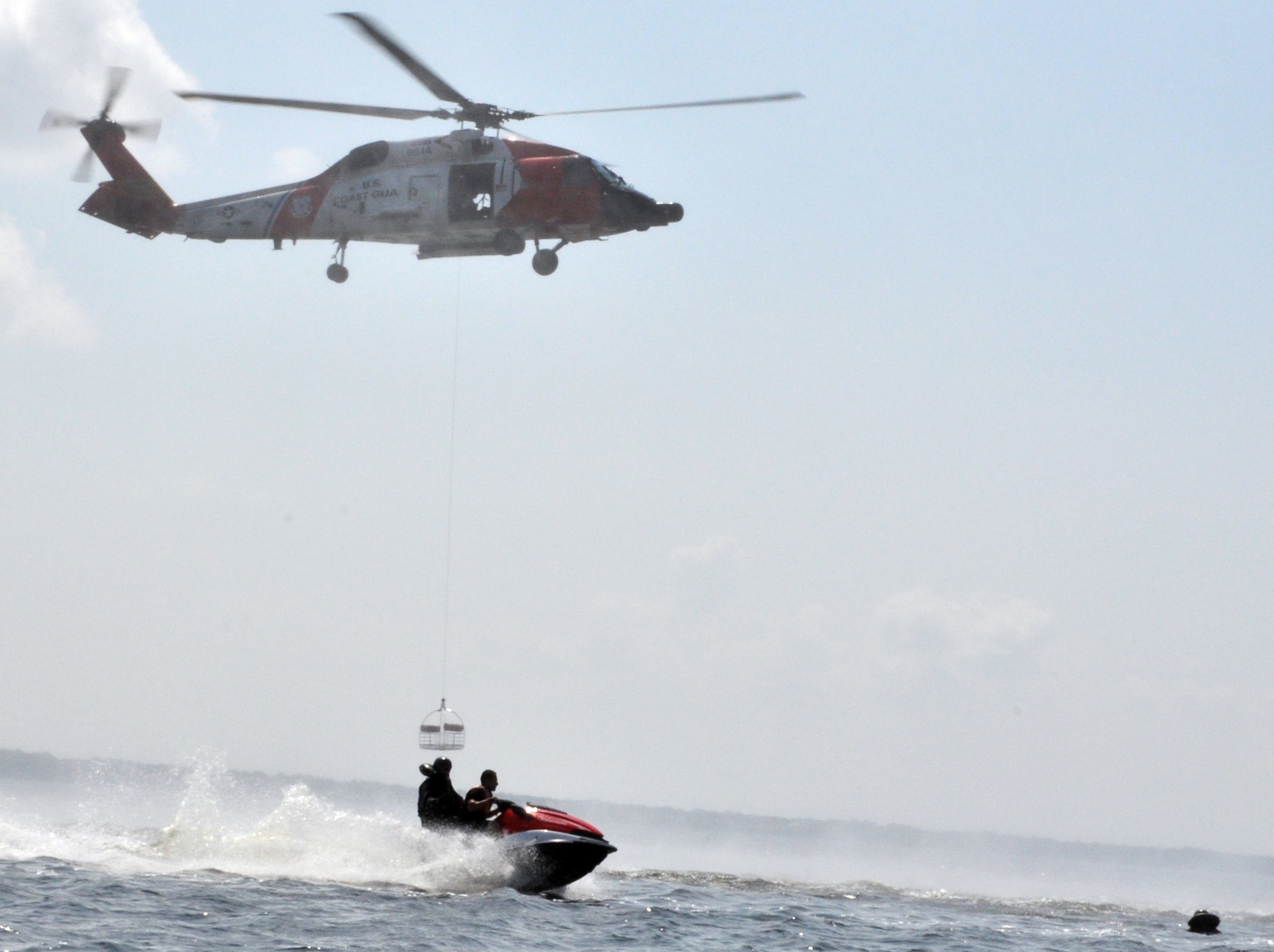 EGLIN AIR FORCE BASE, Fla. – Pilots undergo hoist recovery training during a Survival Evasion Resistance Escape training exercise June 26 at Post’l Point. The training was a water continuation course which included a parachute drag, smoke flare and raft living procedures. Pilots must undergo continuation training every three years. (U.S. Air Force photo/ Airman Anthony Jennings)