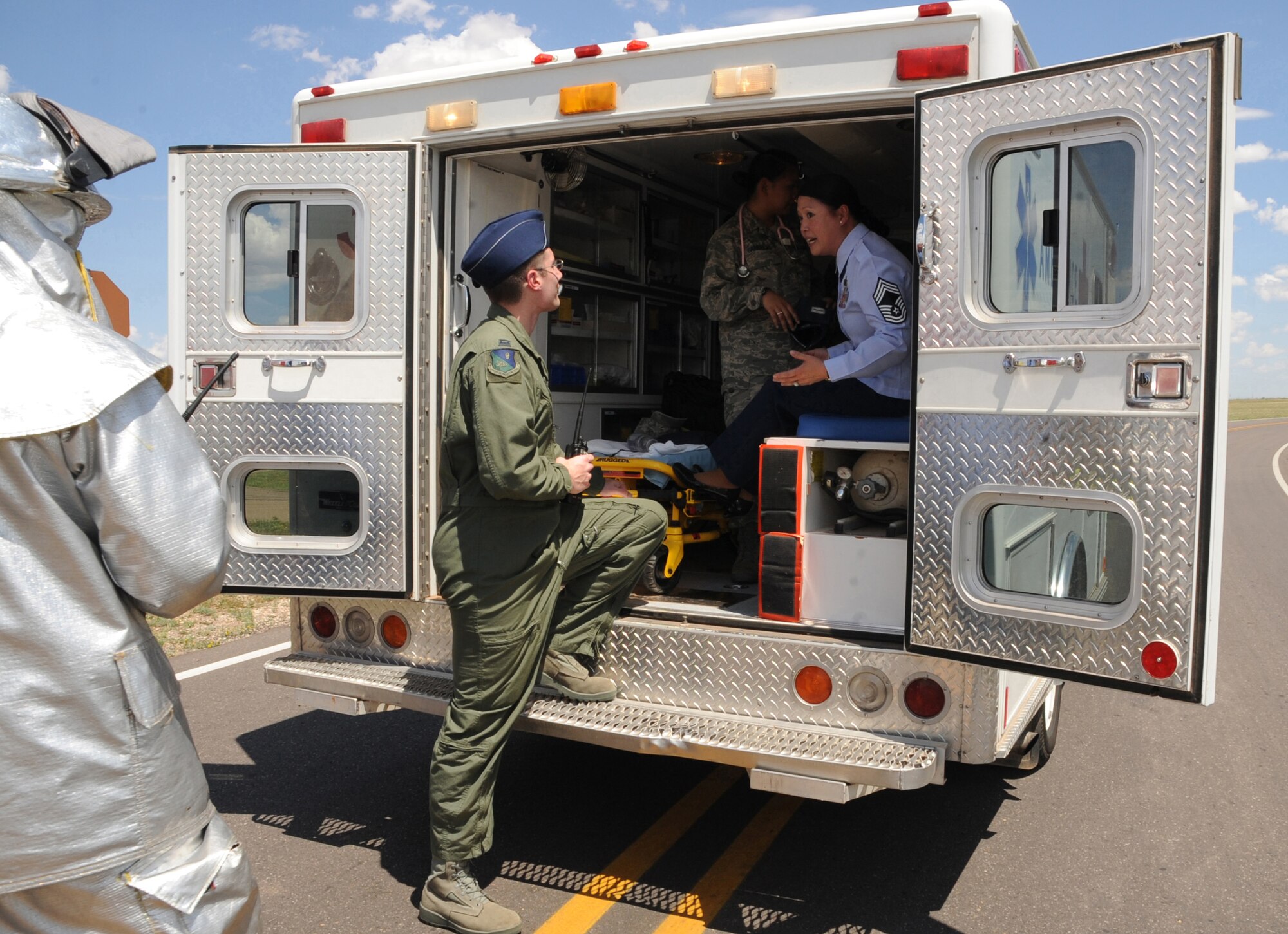 CANNON AIR FORCE BASE, N.M.-- Chief Master Sgt. Maria Lacuesta-Siroin, 27th Special Operations Comptroller Squadron, explains to Capt. John Bisges, 27th Special Operations Aerospace Medicine Squadron, what happened at the scene of a simulated car accident June 22 during an exercise as part of the Unit Compliance Inspection. The exercise prepares Airmen for any real world events. (U.S. Air Force photo by Airman 1st Class Maynelinne De La Cruz)