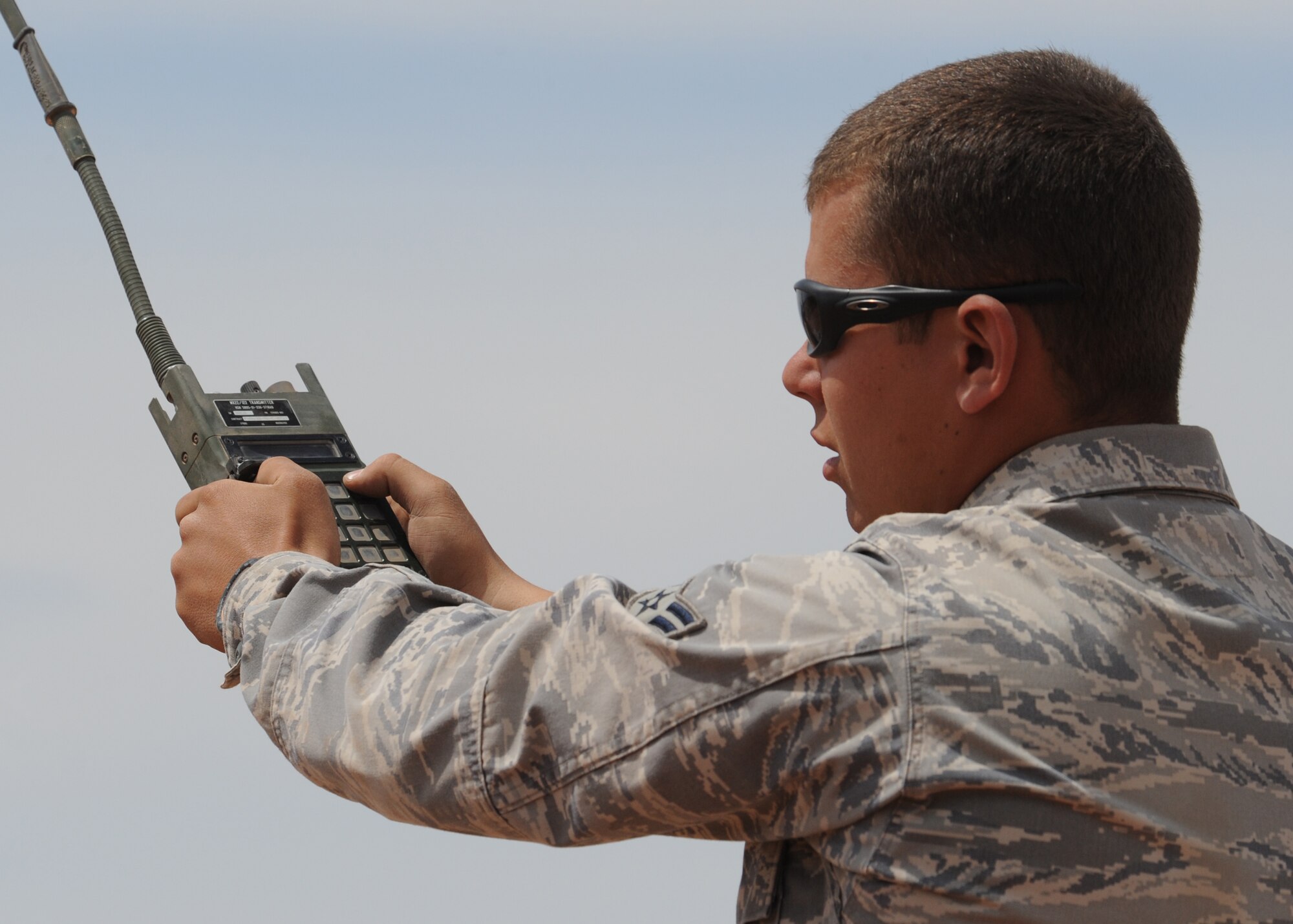 Airman 1st Class Jeffery Derrick, 49th Civil Engineer Squadron explosive ordinance disposal team, uses a remote control detonator to set off the explosives on Red Rio Range on White Sands Missile Range. Members from Holloman Air Force Base, N.M., are working together to clear old ordnance and munitions at Red Rio from 1-30 June. (U.S. Air Force photo/Senior Airman Michael Means)
