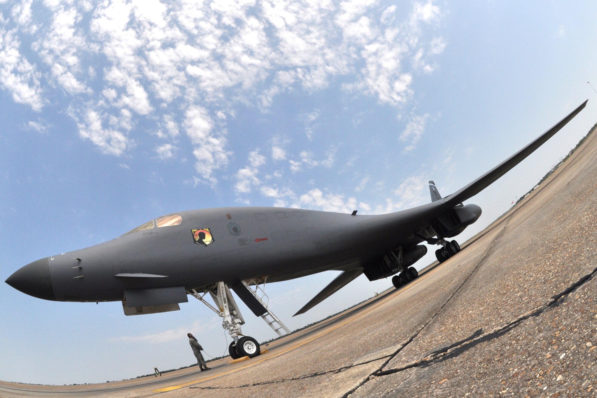 EGLIN AIR FORCE BASE, Fla. --  Staff Sgt. Matthew Penrod, 337th Test and Evaluation Squadron, waits for the green light for the B-1B Lancer to takeoff on its flight back home to Dyess, AFB. The B-1 was piloted by a crew of four, including Col. Mick Guthals, 53rd Wing vice commander. The B-1 was here representing the 337th TES for the assumption-of-command ceremony for the 53rd Wing.  It is a long-range, multi-role, heavy bomber capable of speeds of 900-plus miles per hour. Its wingspan fully extended is 137 feet and can fly intercontinental unrefueled. (U.S. Air Force photo/ Airman Anthony Jennings)