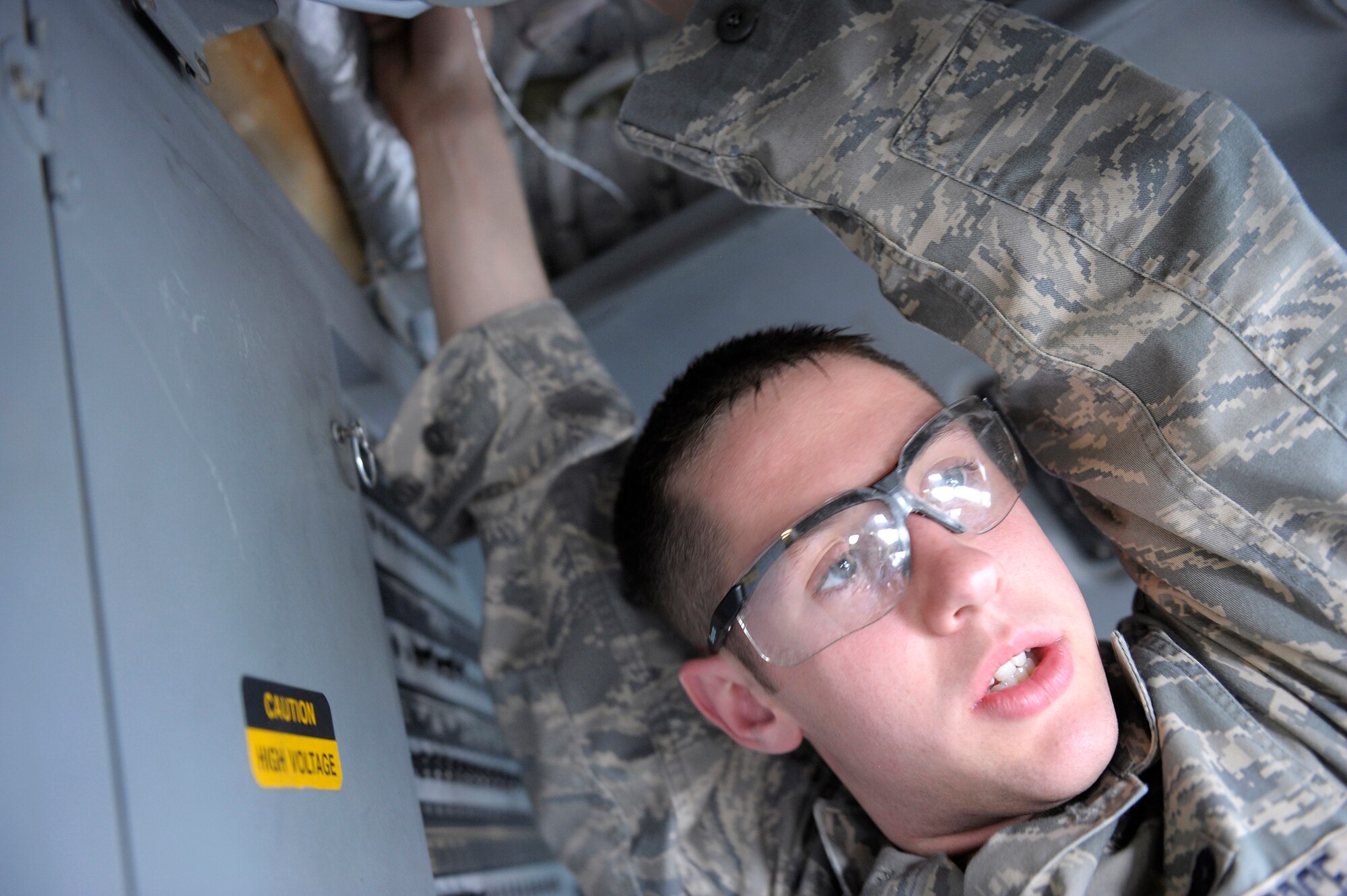 ELMENDORF AIR FORCE BASE, Alaska -- Senior Airman Michael Koch works on a C-17 Globemaster III June 29. Koch is part of an 11-man crew that is preparing for the Air Mobility Command Rodeo at McChord Air Force Base, Wash., July 18-26. (U.S. Air Force photo/Master Sgt. Keith Brown)