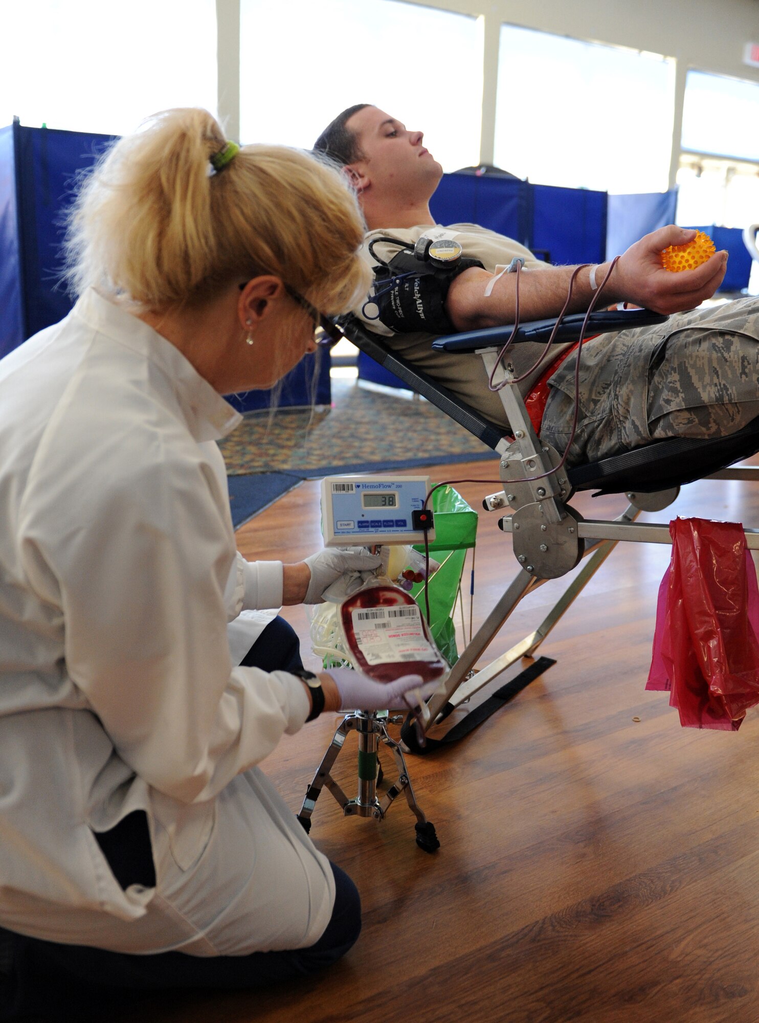 MOUNTAIN HOME AIR FORCE BASE, Idaho -- Staff Sgt Robert Martin, 366th Component Maintenance Squadron aircraft electrician, donates blood as Linda Dumesnil, American Red Cross phlebotomist, monitors his blood flow at a blood drive at the community center June 24. Eighty percent of the blood donations given to the Red Cross are collected at mobile blood drives set up at community organizations, companies, high schools, colleges, places of worship or military installations. The American Red Cross works with more than 50,000 sponsors each year to hold more than 120,000 blood drives, providing convenient locations for people to give blood. (U.S. Air Force photo\Airman 1st Class Debbie Lockhart)