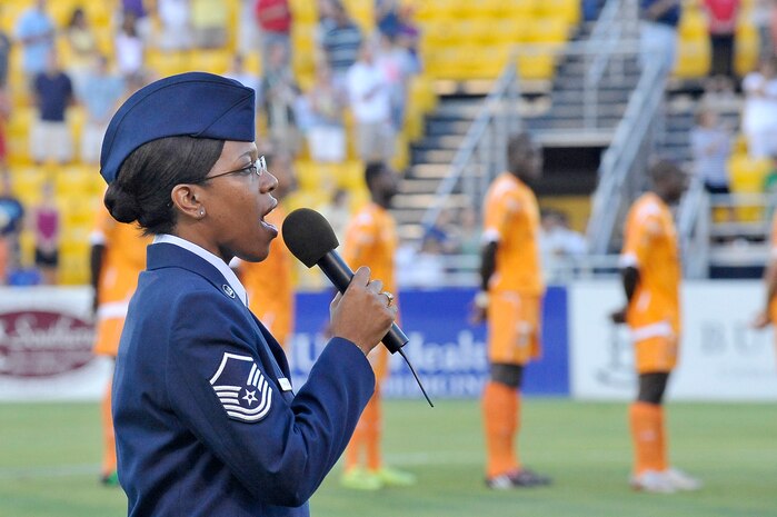 Master Sgt. Nichelle Cunningham sings the national anthem prior to the start of the Charleston Battery soccer game held at Blackbaud Stadium June 25. This was the first of two military appreciation nights held by the Charleston Battery professional soccer team this year.  The second is currently scheduled for September. Sergeant Cunningham is assigned to the 315th Airlift Wing as a paralegal. (U.S. Air Force photo/Staff Sgt. Marie Cassetty)(RELEASED)
