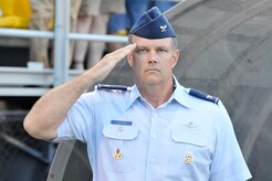 Col. Donald Shaffer salutes during the singing of the national anthem prior to the start of the Charleston Battery soccer game held at Blackbaud Stadium June 25. An estimated 5,000 people attended the military appreciation night held by the Charleston Battery professional soccer team. Colonel Shaffer is the 437th Airlift Wing vice commander. (U.S. Air Force photo/Staff Sgt. Marie Cassetty)(RELEASED)