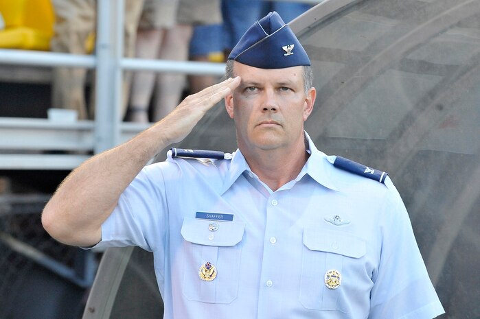 Col. Donald Shaffer salutes during the singing of the national anthem prior to the start of the Charleston Battery soccer game held at Blackbaud Stadium June 25. An estimated 5,000 people attended the military appreciation night held by the Charleston Battery professional soccer team. Colonel Shaffer is the 437th Airlift Wing vice commander. (U.S. Air Force photo/Staff Sgt. Marie Cassetty)(RELEASED)