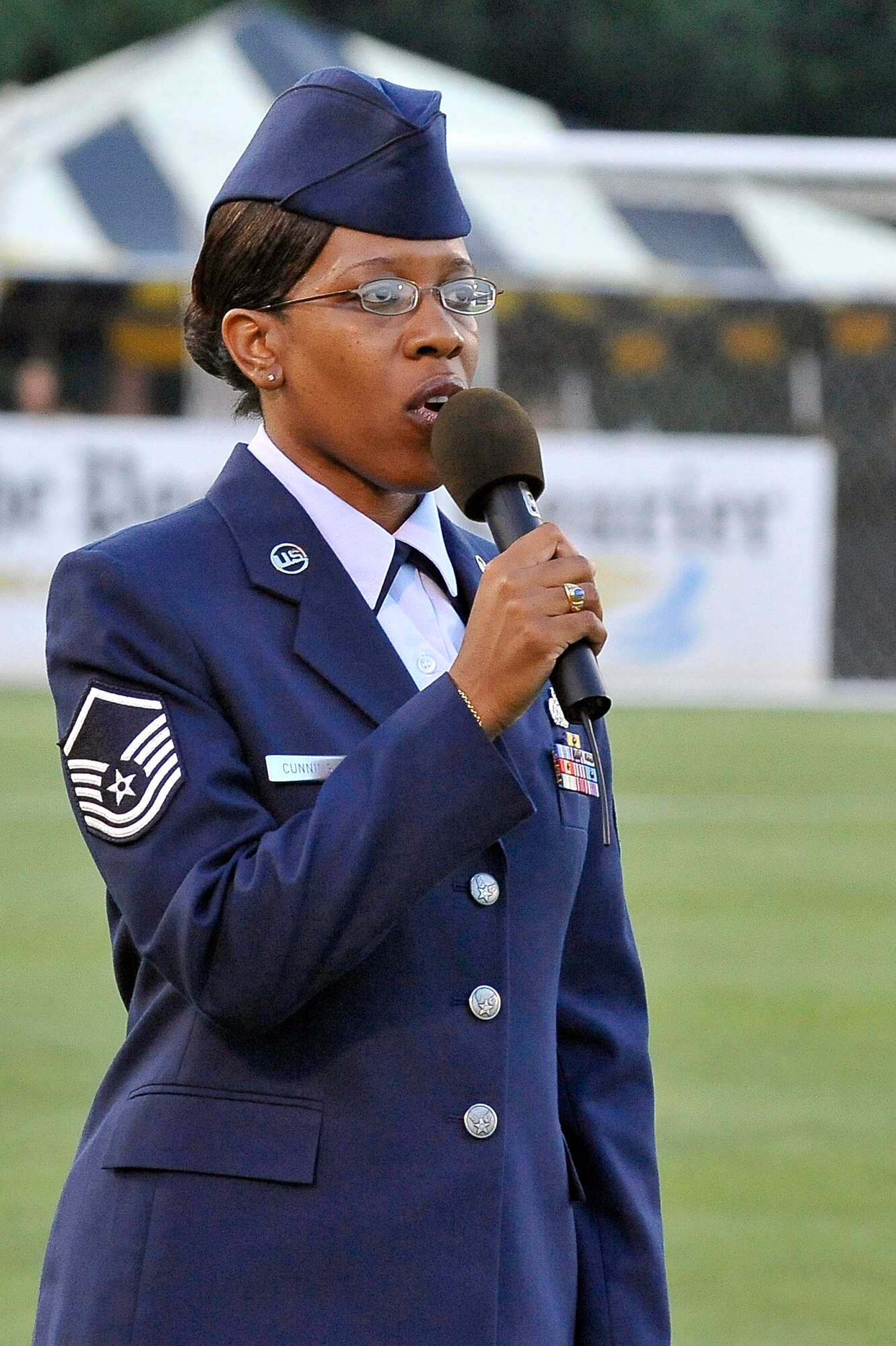Master Sgt. Nichelle Cunningham sings the national anthem prior to the start of the Charleston Battery soccer game held at Blackbaud Stadium June 25. An estimated 5,000 people attended to watch as the Charleston Battery took on the Puerto Rico Islanders during a nationally televised game on the Fox Soccer channel.  Sergeant Cunningham is assigned to the 315th Airlift Wing as a paralegal. (U.S. Air Force photo/Staff Sgt. Marie Cassetty)RELEASED)