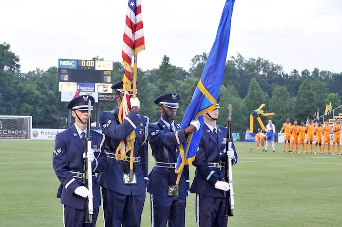 Combined 437th and 315th Airlift Wing honor guard members post the colors at the beginning of the Charleston Battery soccer game during the first of two military appreciation nights at Blackbaud Stadium June 25. The Charleston Battery professional soccer team traditionally holds two military appreciation nights during the year with the first one being in June and the second one in September. (U.S. Air Force photo/Staff Sgt. Marie Cassetty)(RELEASED)