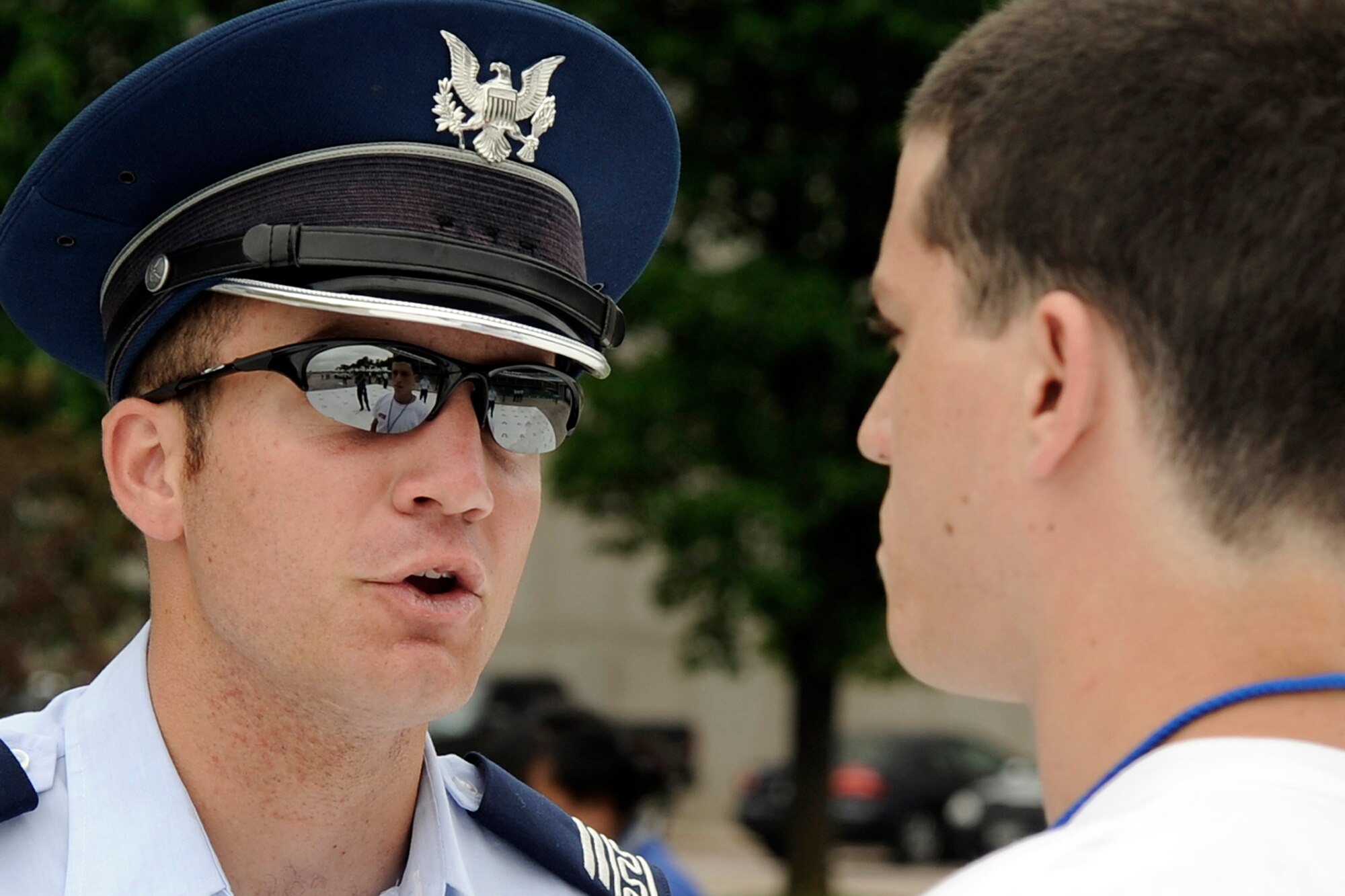 Cadet 2nd Class Anthony Lavy introduces himself to a basic cadet during cadet inprocessing at the U.S. Air Force Academy in Colorado Springs, Colo., June 25. The average basic cadet's unweighted grade point average was 3.86, and 65 percent of the 1,376 members of the Class of 2013 belonged to high school academic honor societies. Cadet Lavy is assigned to Cadet Squadron 27. (U.S. Air Force photo/Dave Ahlschwede)