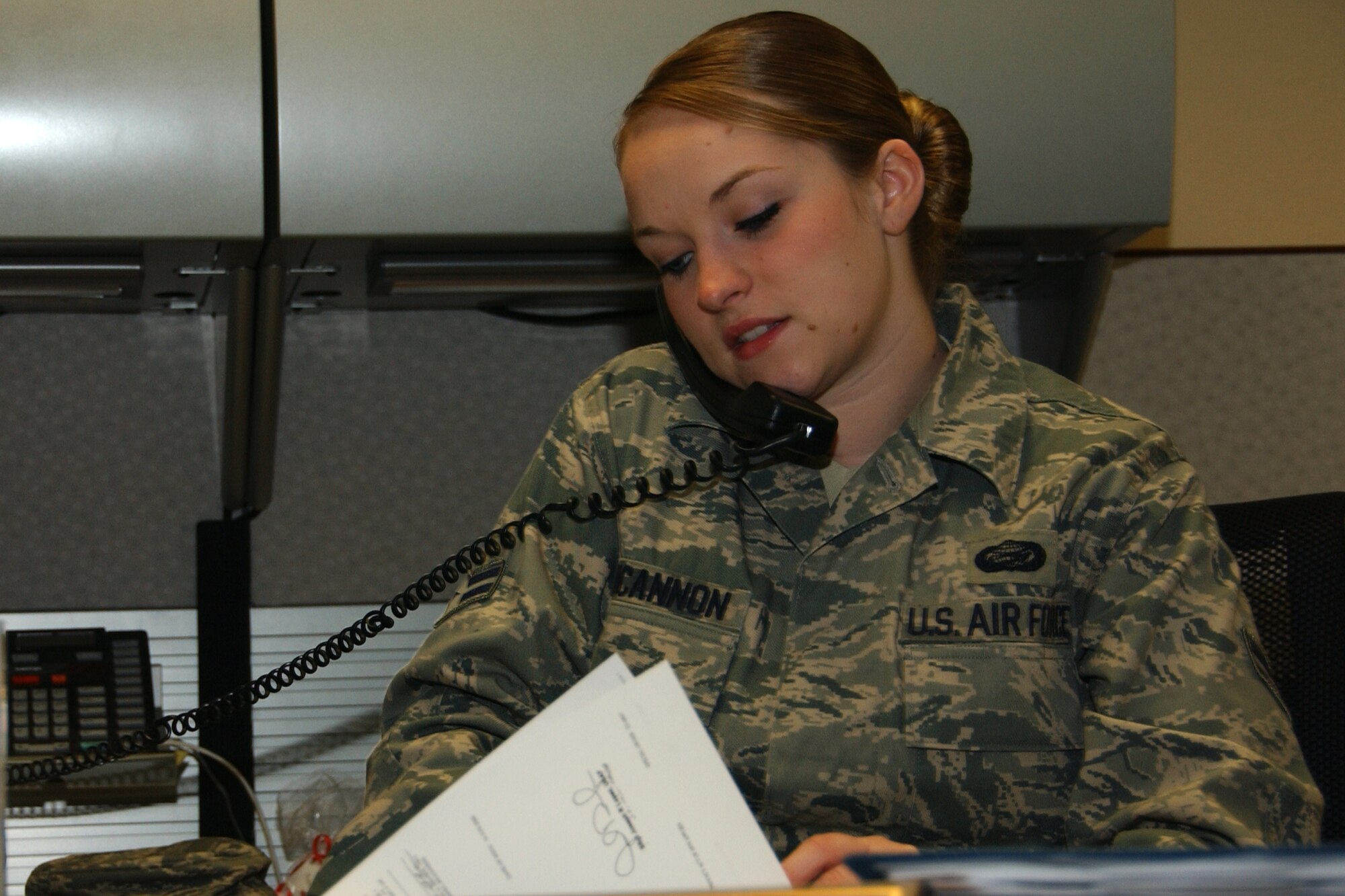 Airman 1st Class Melissa Funcannon, personnel readiness unit journeyman, tracks deployment readiness in the wing deployment center. (U.S. Air Force photo by Staff Sgt. Brian Hill)
