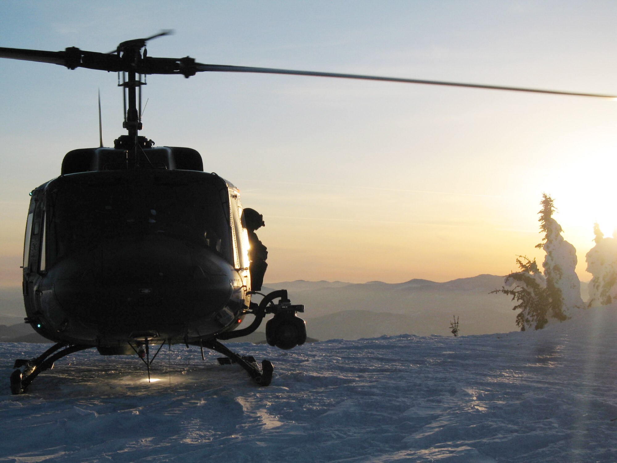 A UH-1N Iroquois sits on the top of Calispel mountain in the northern survival training area June 26 in Washington. Airmen of the 36th Rescue Flight from Fairchild Air Force Base, Wash., rescued a hiker from Fort Lewis, Wash., who tumbled more than 1,000 feet down a mountain just west of Wenatchee, Wash. (U.S. Air Force photo/Staff Sgt. Jacob Bragg) 