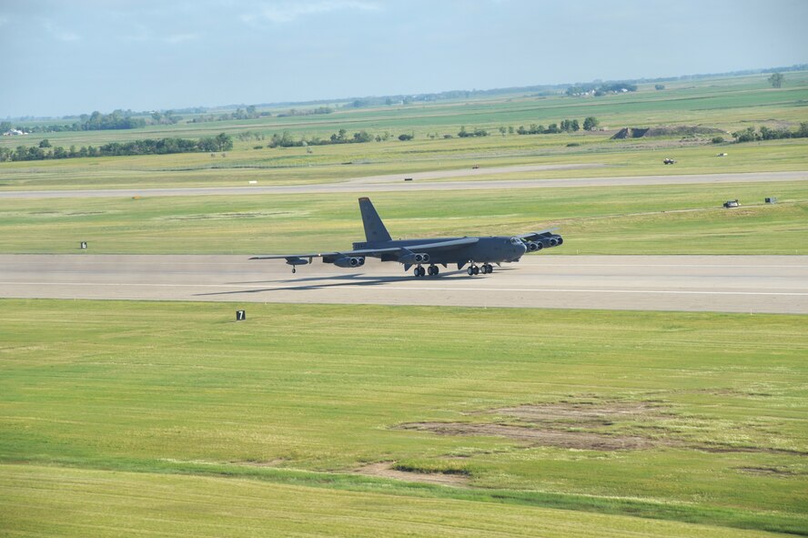 MINOT AIR FORCE BASE ND --  A B-52H Stratofortress roars down the runway during the rapid launch portion of Global Thunder 09 here June 30. Global Thunder 09 is the USSTRATCOM Field Training Exercise and Battle Staff Exercise designed to exercise all mission areas with primary emphasis on Nuclear Command and Control (NC2). Global Thunder 09 provides training opportunities for component, task force, unit, forces, and command posts to deter, and if necessary defeat, a military attack against the United States and to employ forces as directed by the President. (U.S. Air Force photo by Tech. Sgt. Linda Miller)