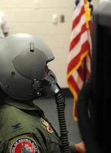 LANGLEY AIR FORCE BASE, Va. -- Col. Bryan Turner, 192nd Operations Group commander, tests out the Reduced Oxygen Breathing Device trainer here June 29. This device records a pilot's reaction to low oxygen levels.  This is the first new hypoxia trainer in the Air Force in over 60 years.  (U.S. Air Force photo/Senior Airman Zachary Wolf)
