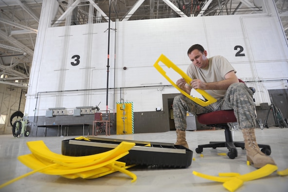 Tech. Sgt. Erik Louviere creates a custom travel kit for tools and equipment needed for Air Mobility Rodeo 2009, a world-wide readiness competition scheduled for July 19-25 at McChord AFB, Washington. Sergeant Louviere is an active-duty Airman assigned to the 22nd Aircraft Maintenance Squadron at McConnell Air Force Base, Kan. Sergeant Louviere is part of a Reserve and Regular (active-duty) team at McConnell preparing for Rodeo. (U.S. Air Force photo/Tech. Sgt. Jason Schaap)