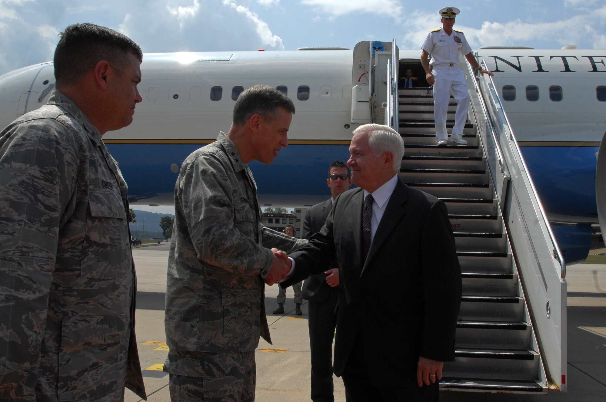 U.S. Air Force Maj. Gen. William Chambers, U.S. Air Forces in Europe vice commander, greets U.S. Secretary of Defense Robert M. Gates, June 30, 2009, Ramstein Air Base, Germany. Secretary Gates arrived at Ramstein en route to Landstuhl Regional Medical Center, Germany, to visit wounded U.S. military members being treated there. (U.S. Air Force photo by Senior Airman Kenny Holston)