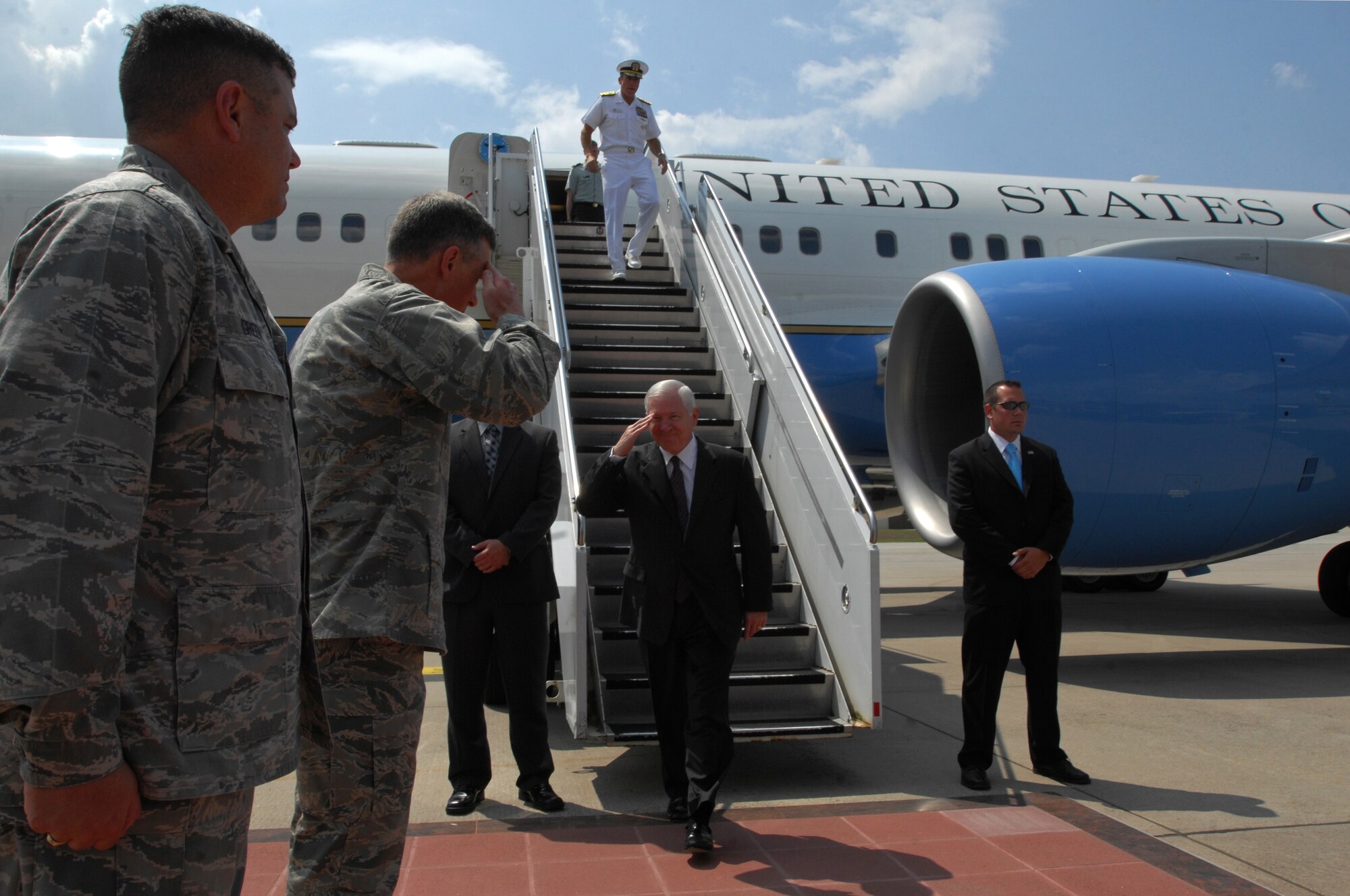 U.S. Air Force Maj. Gen. William Chambers, U.S. Air Forces in Europe vice commander, salutes U.S. Secretary of Defense Robert M. Gates, June 30, 2009, Ramstein Air Base, Germany. Secretary Gates arrived at Ramstein en route to Landstuhl Regional Medical Center, Germany, to visit wounded U.S. military members being treated there. (U.S. Air Force photo by Senior Airman Kenny Holston)