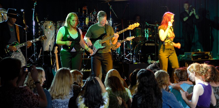 "The Lt. Dan Band" plays for a standing room only crowd, June 28, at the Osan Air Base, Republic of Korea, base theater. The band's mission is to do what it can to draw attention to military service members, their families and veterans and to make sure they know they are remembered and appreciated. (U.S. Air Force photo/Staff Sgt. Brian Ferguson)