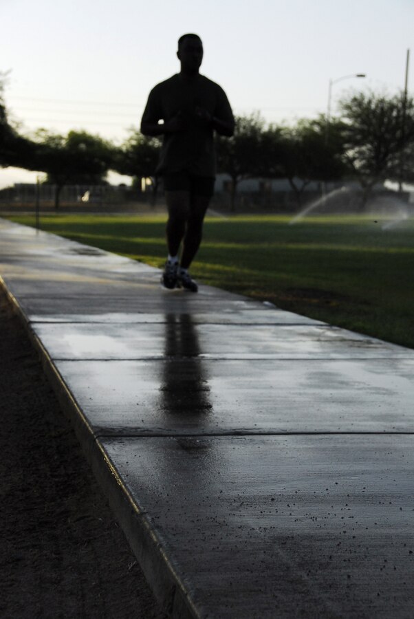 Gunnery Sgt. Thomas Christian, station air traffic controller, runs past the half-way point of the Marine Corps Air Station’s physical fitness test course in Yuma, Ariz., during a Headquarters and Headquarters Squadron PFT June 30, 2009. Active duty Marines are required to run two PFTs annually, one before June 30 and one before Dec. 31.