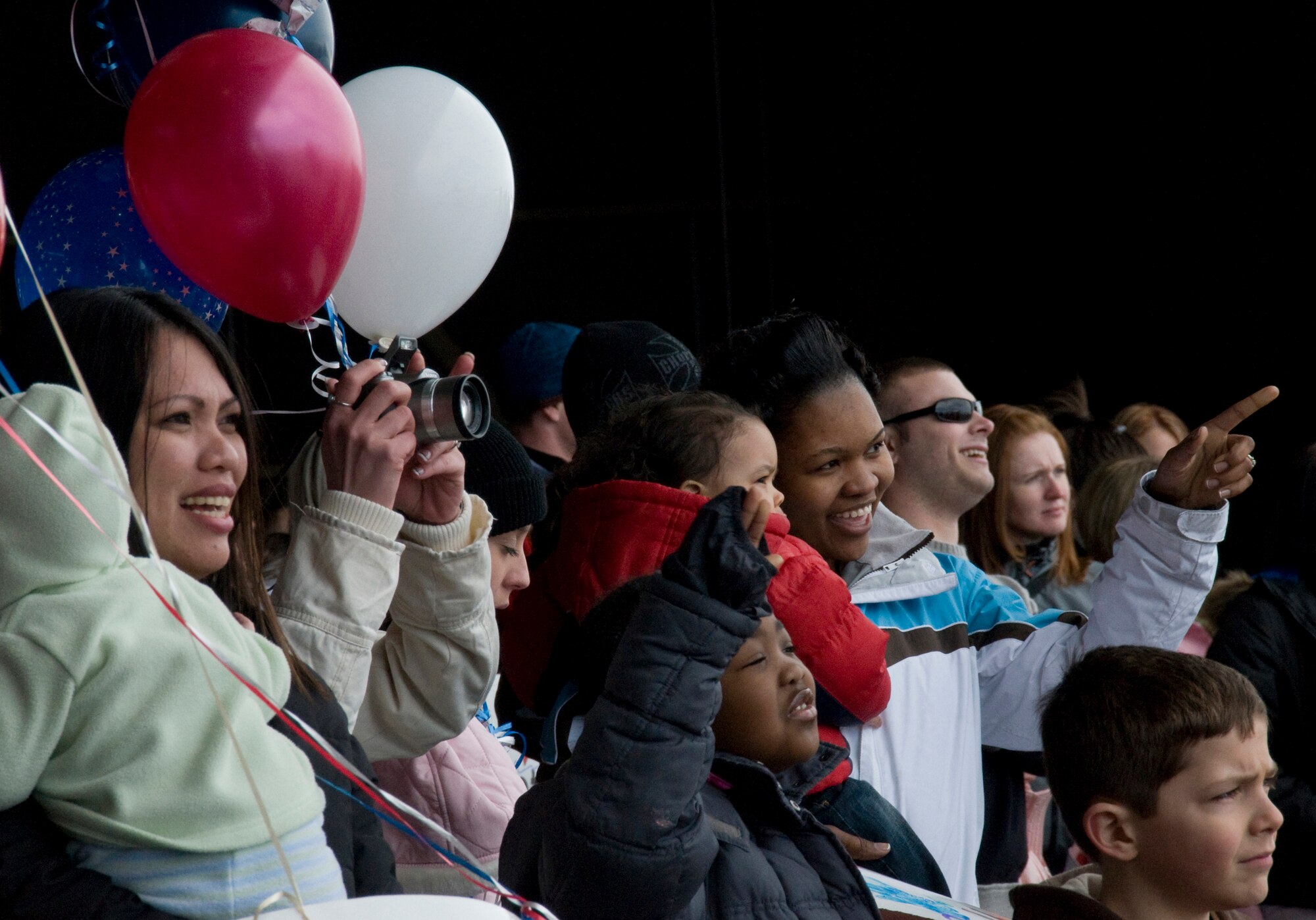 MISAWA AIR BASE, Japan -- Family members cheer the arrival of the 14th Fighter Squadron and 35th Maintenance Squadron March 1, 2009. Families gathered early Sunday morning waiting for their loved ones to return from Joint Base Balad, Iraq. (U.S. Air Force photo by Staff Sgt. Araceli Alarcon) 