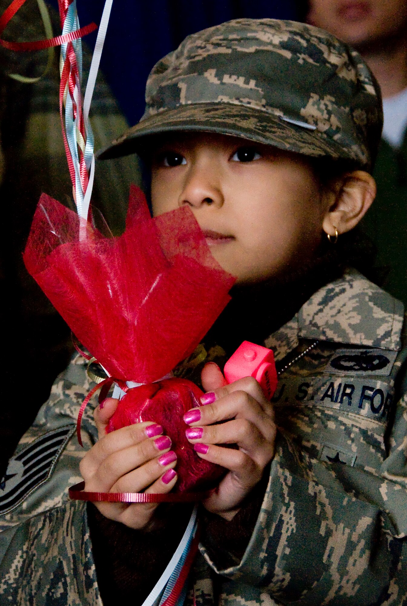 MISAWA AIR BASE, Japan -- Havoi Moreno, 6, daughter of Staff Sgt. Jose Moreno, waits for her father March 1, 2009. Sergeant Moreno, from El Paso, Texas, was one of the many members deployed to Joint Base Balad, Iraq, in support of the 14th Fighter Squadron. (U.S. Air Force photo by Staff Sgt. Araceli Alarcon) 