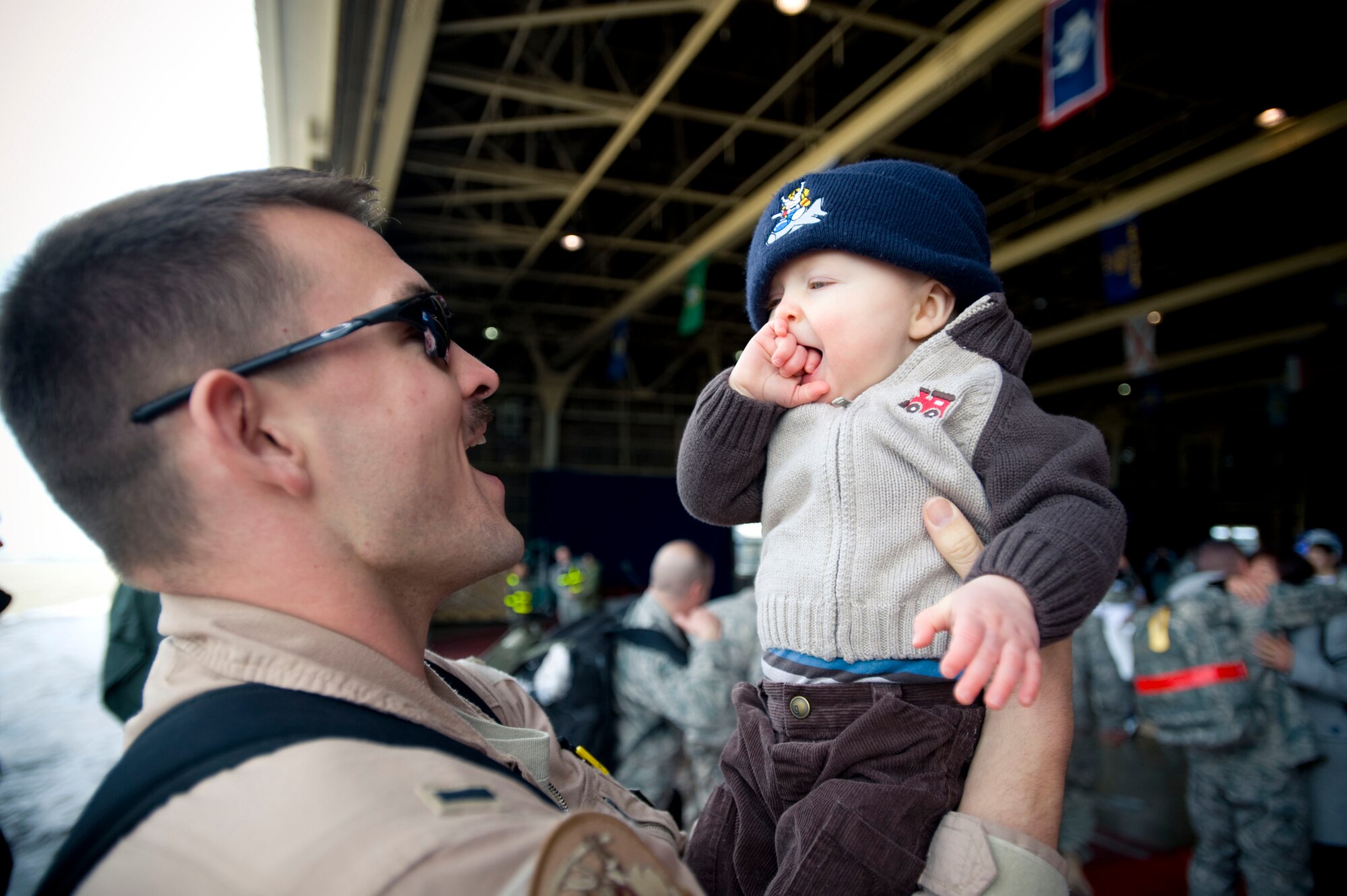 MISAWA AIR BASE, Japan - 1st Lt. Ryan Cross, 14th Fighter Squadron pilot, holds his son March 1, 2009. Lieutenant Cross returned from a deployment to Joint Base Balad, Iraq. He and his family hail from Niceville, Fla. (U.S. Air Force photo by Staff Sgt. Samuel Morse)