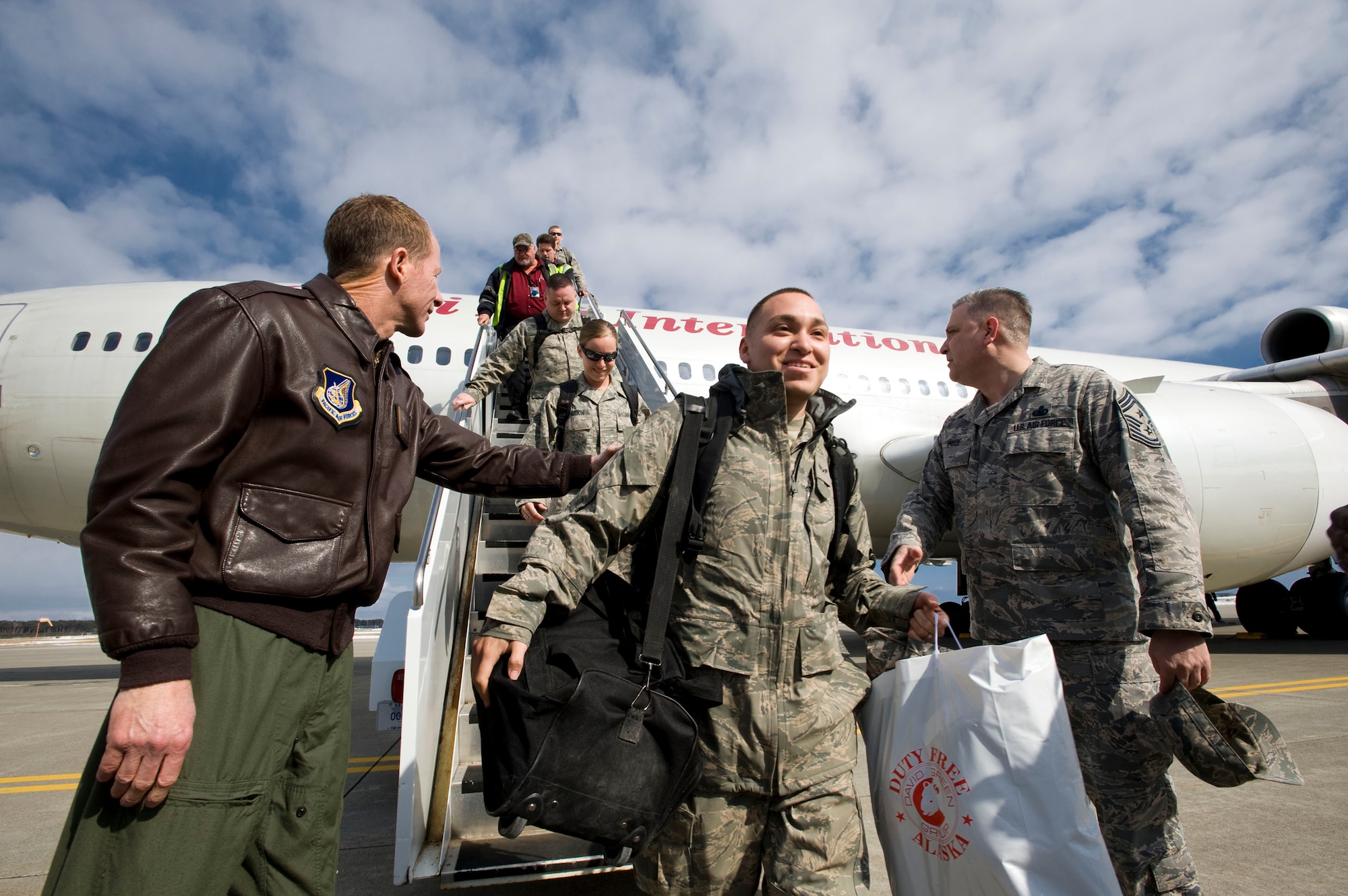 MISAWA AIR BASE, Japan -- Col. David Stilwell, 35th Fighter Wing commander, and Command Chief Master Sgt. Rick Price, 35th Fighter Wing command chief, greet returning Airmen March 1, 2009. The Airmen were deployed to Joint Base Balad, Iraq. (U.S. Air Force photo by Staff Sgt. Samuel Morse)