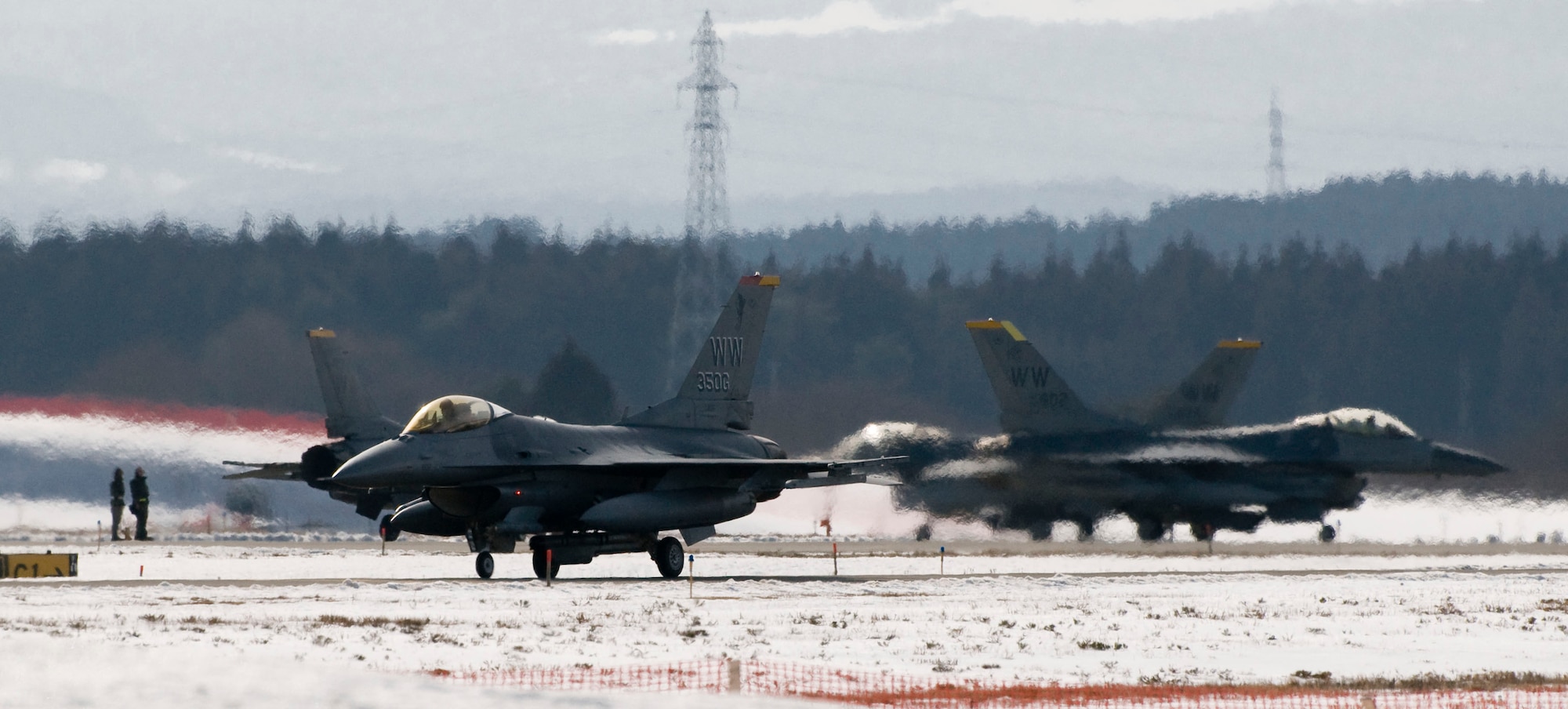 MISAWA AIR BASE, Japan -- Jets from the 14th Fighter Squadron taxi off the runway Feb. 27, 2009. The 35th Fighter Wing Commander Col. David Stilwell met the F-16s on the taxi ramp to welcome them home after their deployment. (U.S. Air Force photo by Staff Sgt. Samuel Morse)