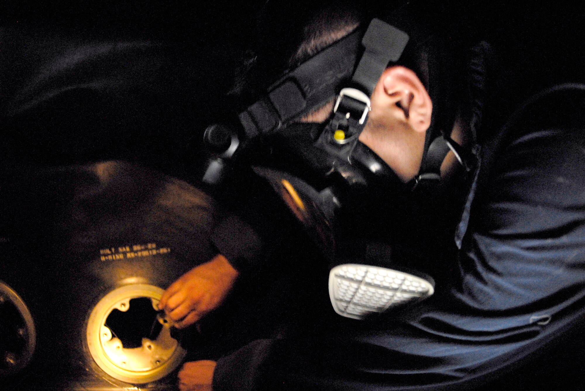 Airman 1st Class Rodolfo Quiroz, a 379th Expeditionary Maintenance Squadron Aircraft Fuel Systems Repair Apprentice, is in the forward body fuel cell of a KC-135R Stratotanker removing the fuel bladder, Feb. 27, 2009, at an undisclosed location in Southwest Asia.  Airman Quiroz hails from Bay City, Mich. and is deployed from McConnell Air Force Base, Kan. in support of Operations Iraqi and Enduring Freedom and Combined Joint Task Force - Horn of Africa. (U.S. Air Force photo/Senior Airman Andrew Satran/released)