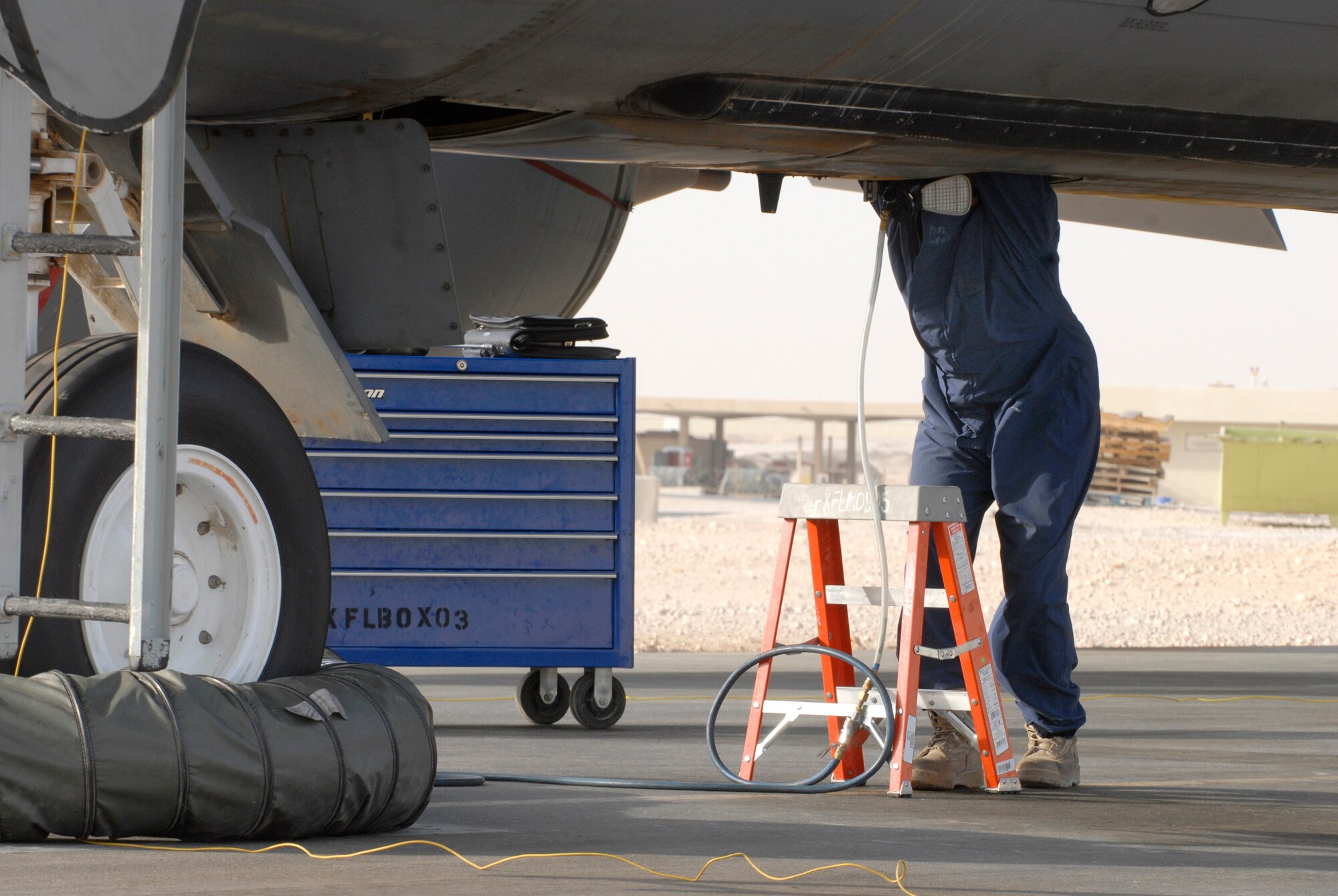 Airman 1st Class Rodolfo Quiroz, a 379th Expeditionary Maintenance Squadron Aircraft Fuel Systems Repair Apprentice, climbs into a forward body cell to replace a fuel bladder on a KC-135R Stratotanker Feb. 27, 2009, at an undisclosed location in Southwest Asia.  Airman Quiroz hails from Bay City, Mich. and is deployed from McConnell Air Force Base, Kan. in support of Operations Iraqi and Enduring Freedom and Combined Joint Task Force - Horn of Africa.  (U.S. Air Force photo/Senior Airman Andrew Satran/released)