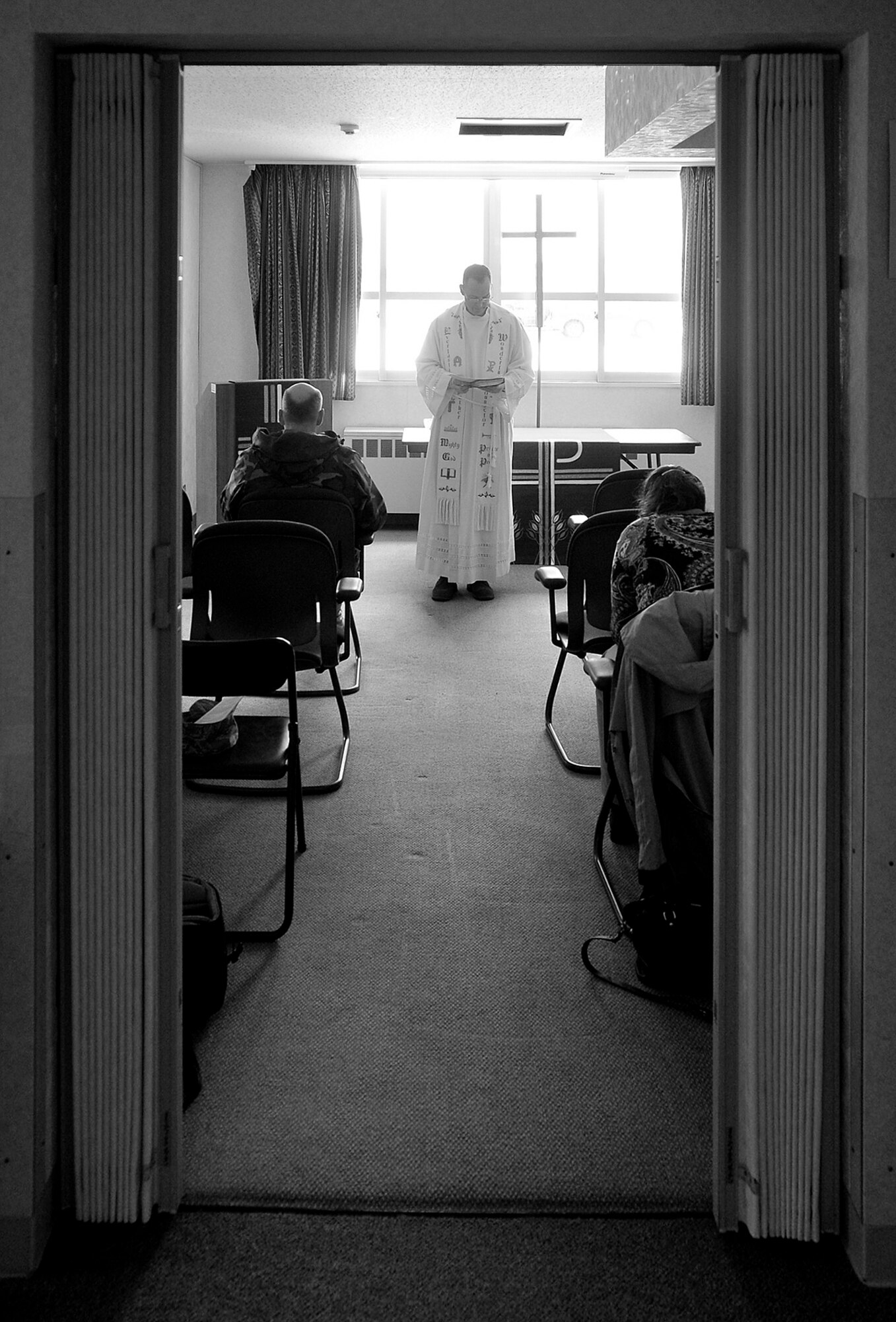 MISAWA AIR BASE, Japan -- Chaplain (Capt.) Richard Beyea, 35th Fighter Wing base chaplain, gives the Protestant Ash Wednesday Service Feb. 25, 2009. Ash Wednesday gets its name from the practice of placing ashes on the foreheads of the faithful as a sign of repentance. (U.S. Air Force photo by Senior Airman Chad Strohmeyer)