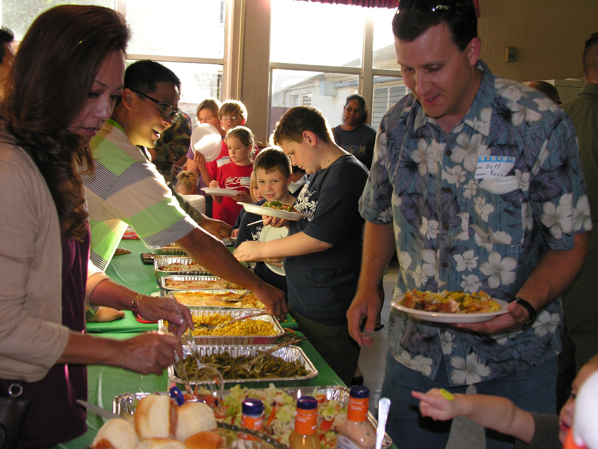 Deployed family members were served dinner by 15th Airlift Wing Chapel Traditional Service volunteers during the Airman and Family Readiness Center’s monthly activity dinner.  (U.S. Air Force photo/Jackie Hites)