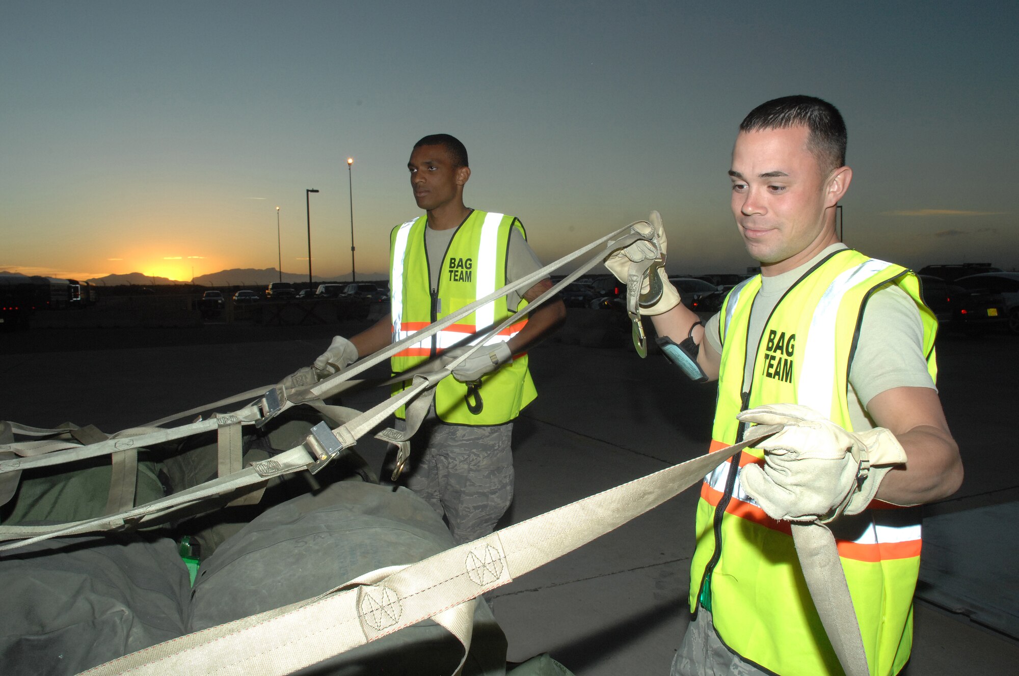 Airman First Class Jarvis Hightower and Airman First Class Willis take part in a Phase I Exercise at Holloman Air Force Base, N.M., on Feb. 25; 2009. The Airmen are supporting the exercise as part of a 49th Logistics Readiness Squadron. (U.S Air Force photo/Senior Airman Russell Scalf)
