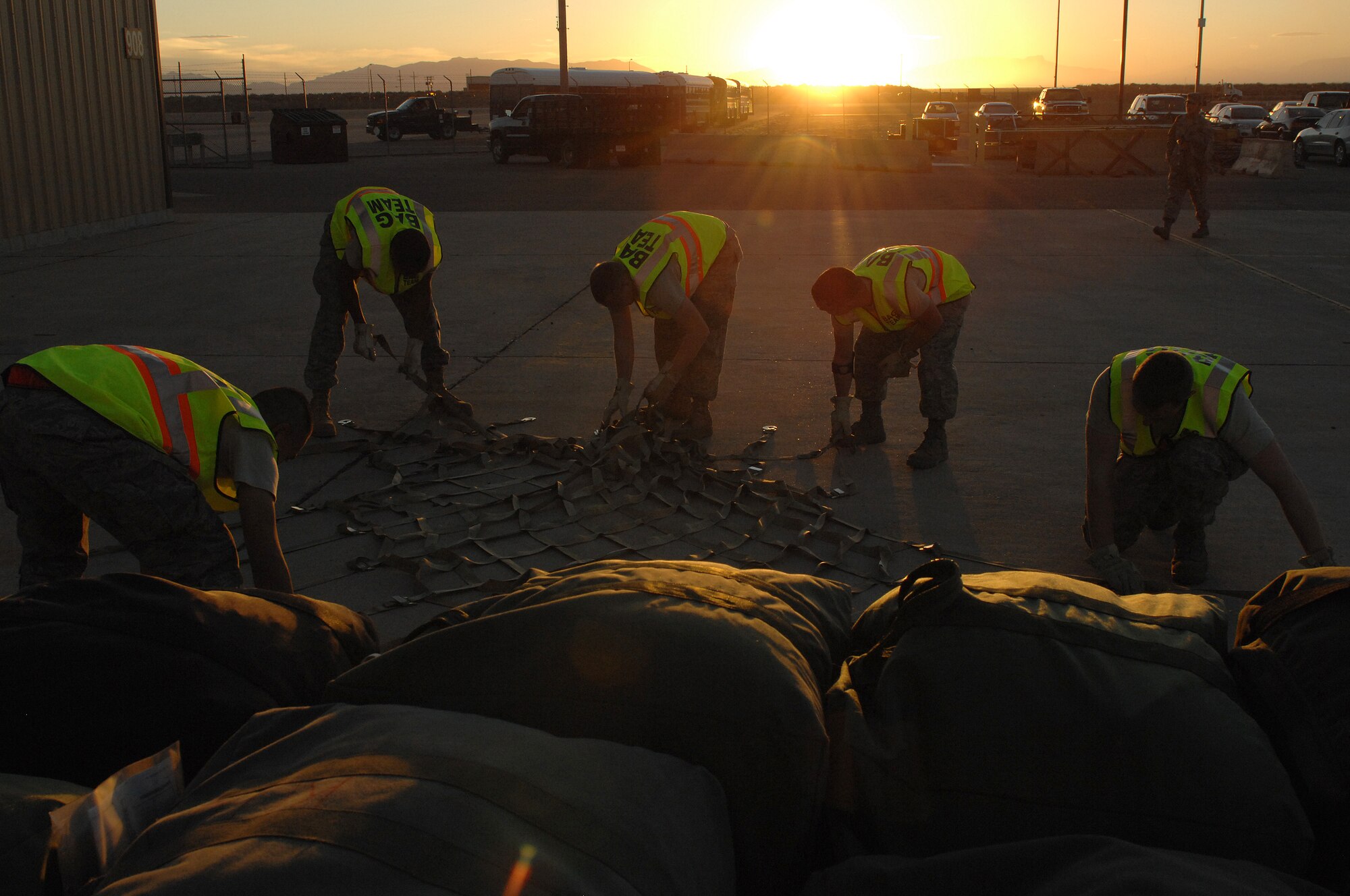 Members of the 49th Logistics Readiness Squadron prepare mobility bags for transport during a Phase I Exercise at Holloman Air Force Base, N.M., on Feb. 25; 2009. The mobility bags contain essential items for deploying Airmen to accomplish their mission. (U.S Air Force photo/Senior Airman Russell Scalf)
