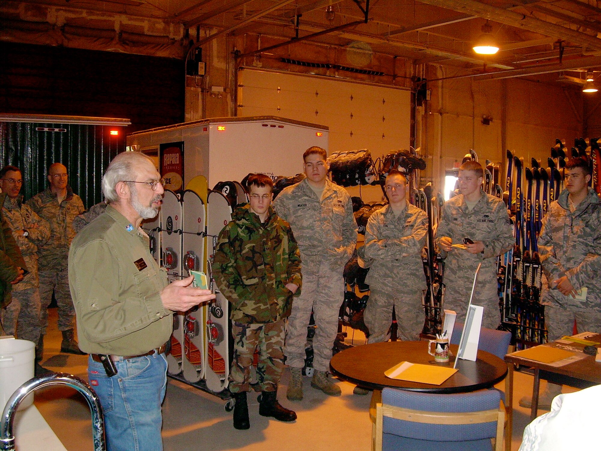 John Gorman, 319th Force Support Squadron, explains outdoor recreation services offered to Grand Forks Air Force Base community members to members of the 319th Communications Squadron. Lt. Col. Sam Bass, 319 CS commander, recently established an Airmen Mentorship Program within the squadron to focus on the professional and personal development of comm. Airmen. The most recent AMP session sent Airmen of 319 CS to outdoor recreation.