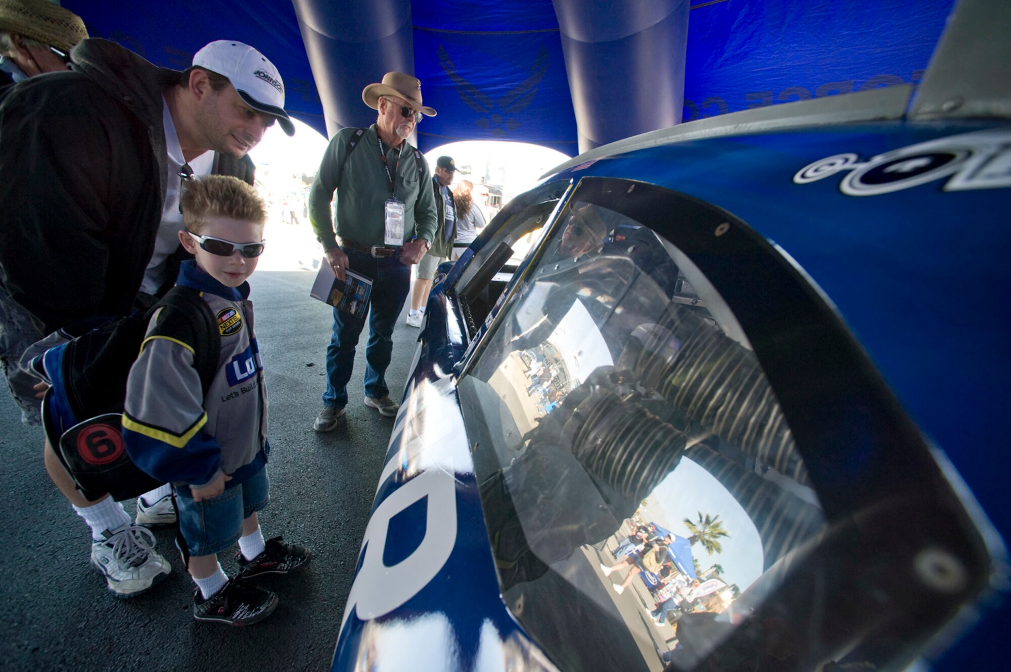 Race fans view the new Air Force sponsored No. 43 Dodge Feb. 28 at the Las Vegas Motor Speedway in Nevada. The Air Force paint scheme will be on the track in 2009 at Dover International Speedway, Del., Talledega Superspeedway, Ala., Daytona International Speedway, Fla., and Lowes Motor Speedway in Charlotte, N.C. (U.S. Air Force photo/Master Sgt. Jack Braden)