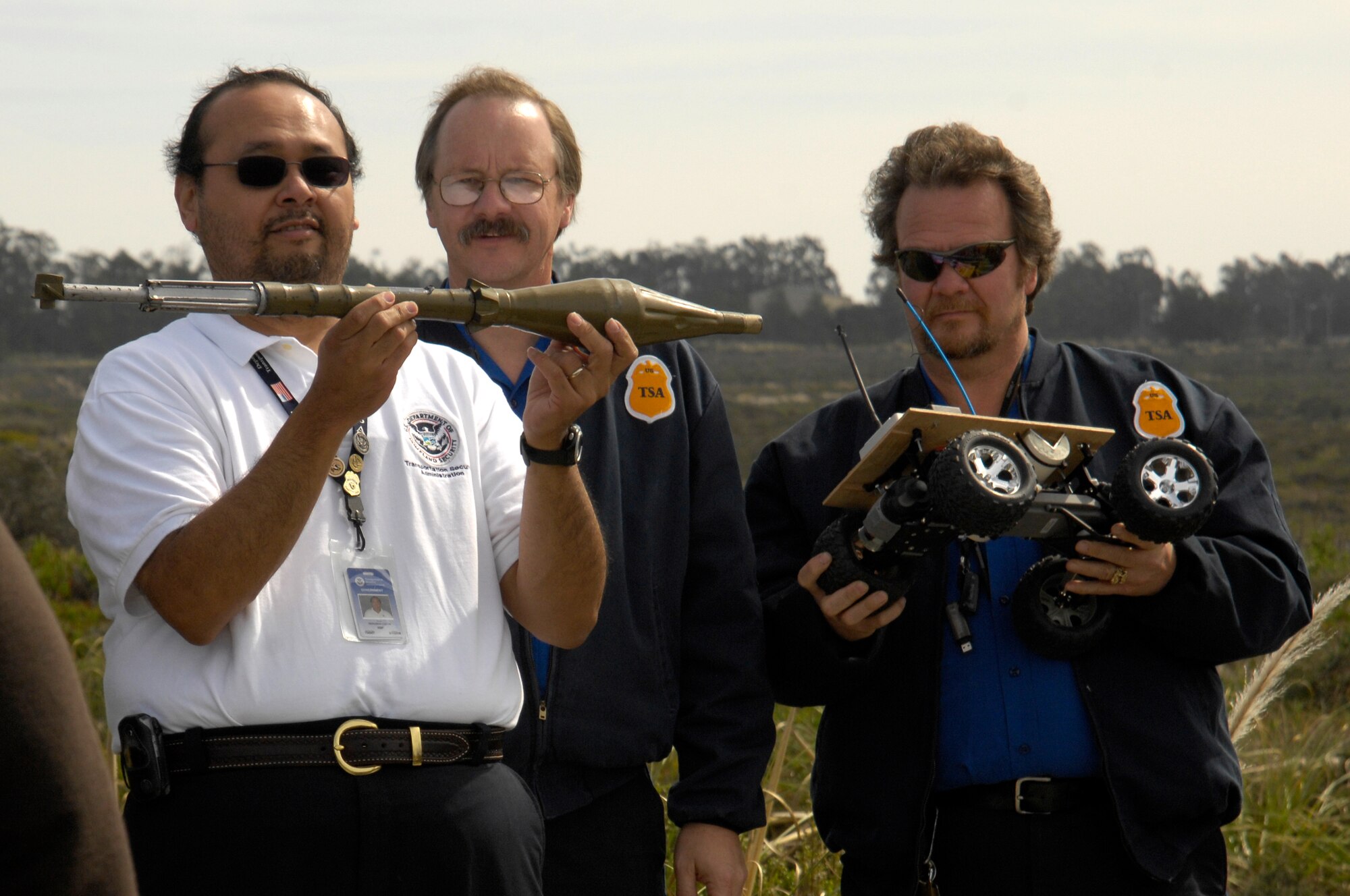 VANDENBERG AIR FORCE BASE, Calif. -- Members with the Transportation Security Administration examine a rocket propelled grenade and a modified remote control car as they are passed around during their training brief given by explosive ordnance disposal technicians from the 30th Civil Engineer Squadron Feb 27 here. (U.S. Air Force photo/Senior Airman Matthew Plew)